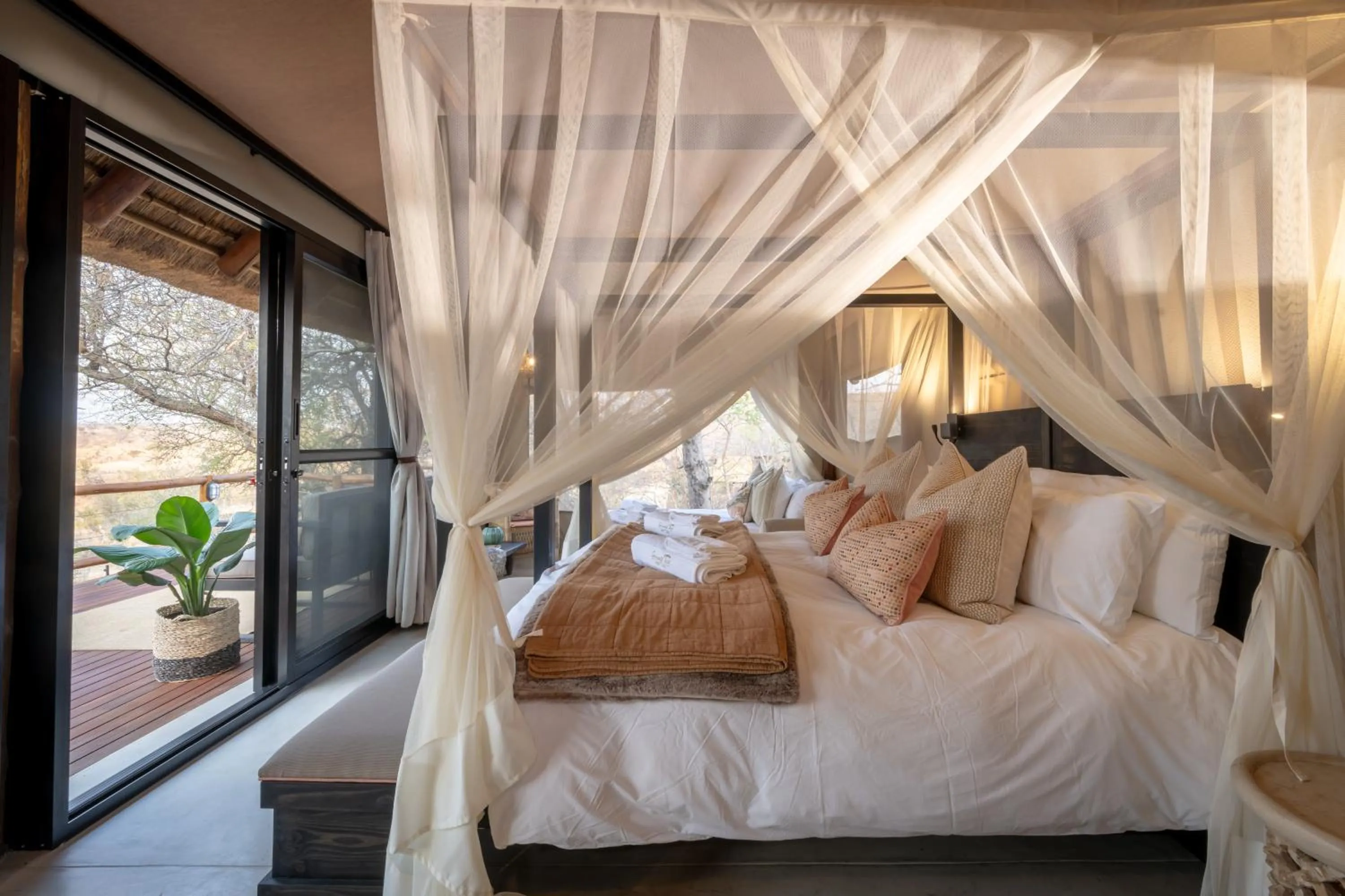 Property building, Bed in Sausage Tree Safari Camp