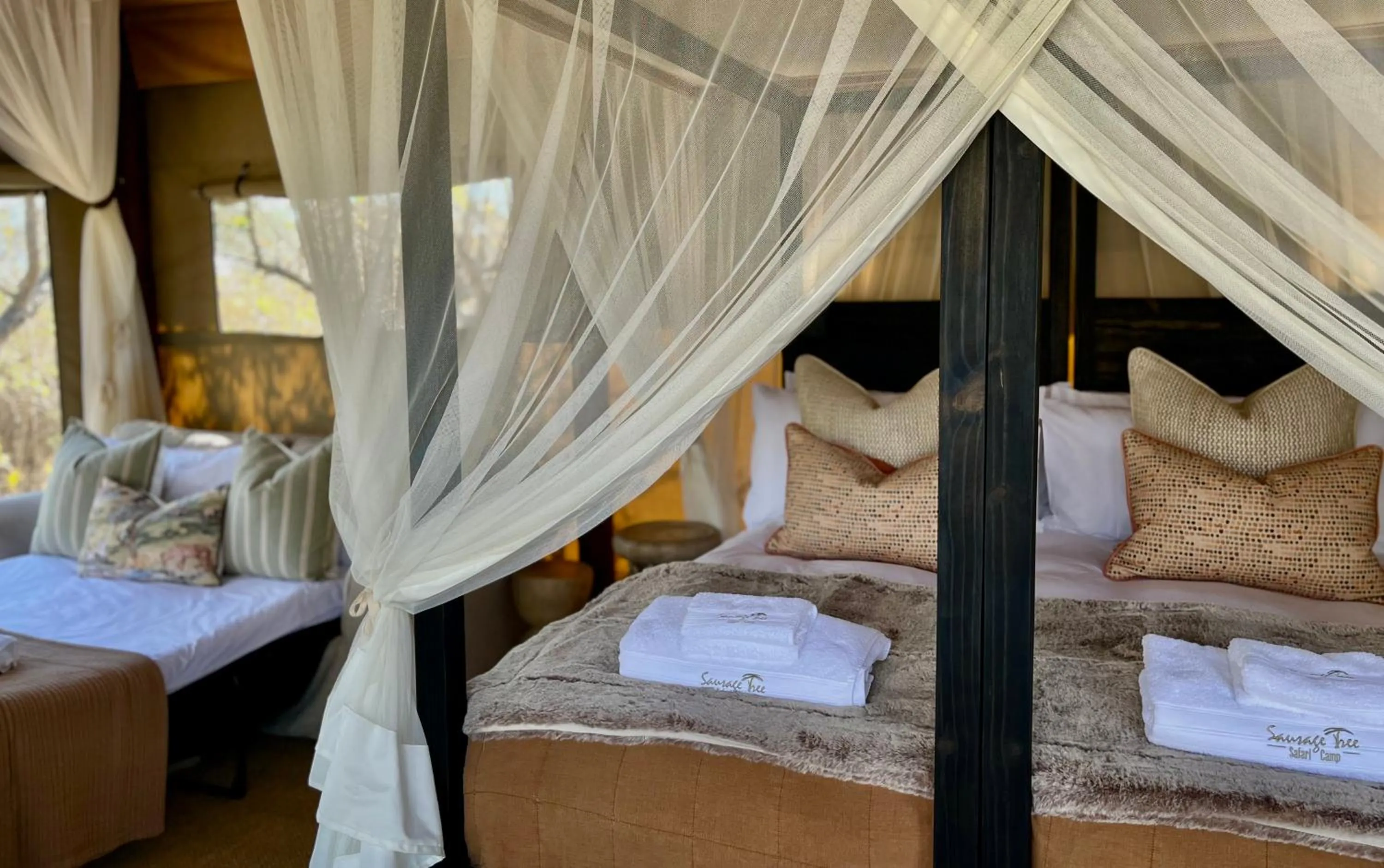 Property building, Bed in Sausage Tree Safari Camp