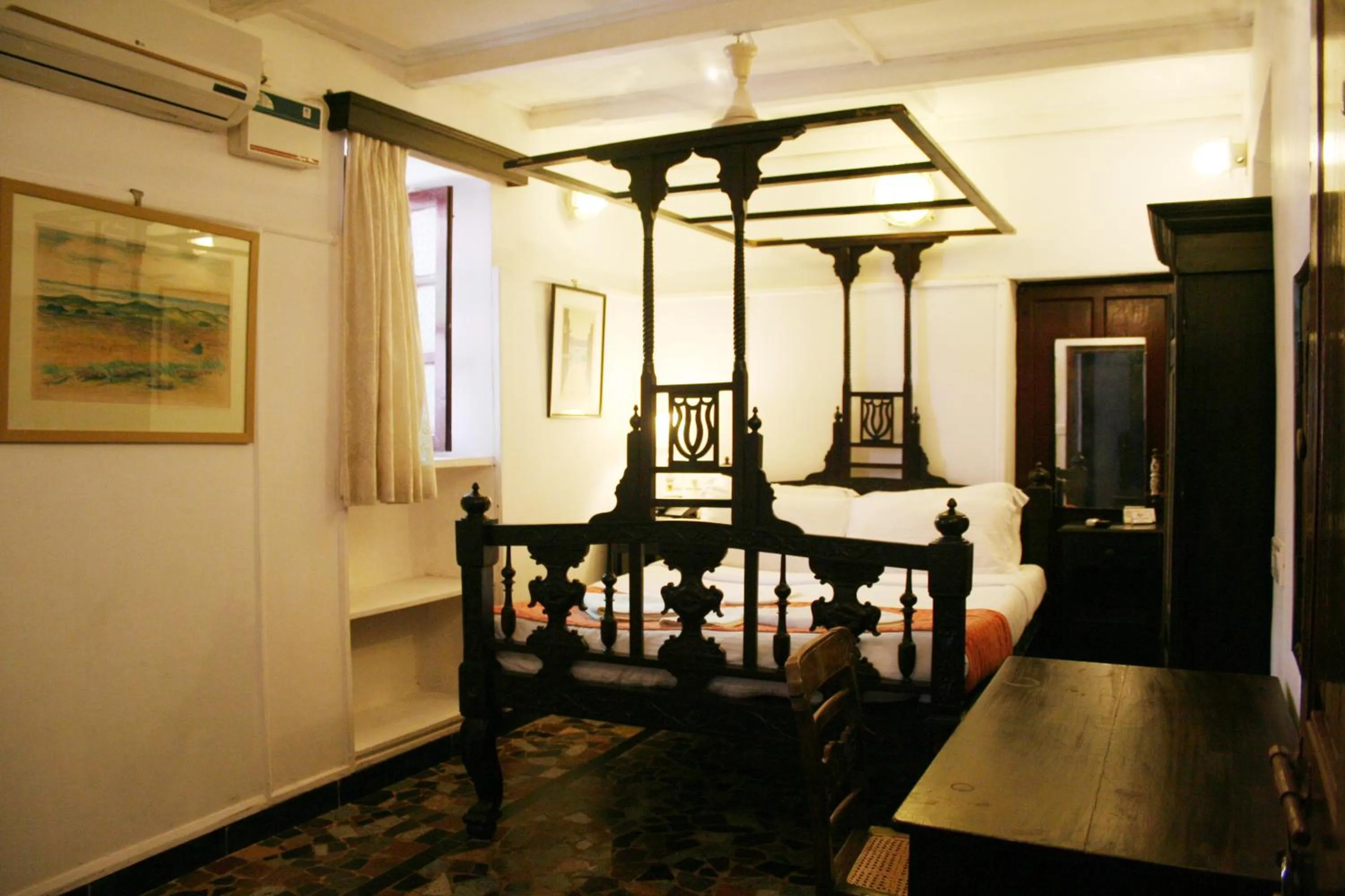 Bed in WelcomHeritage Panjim Pousada