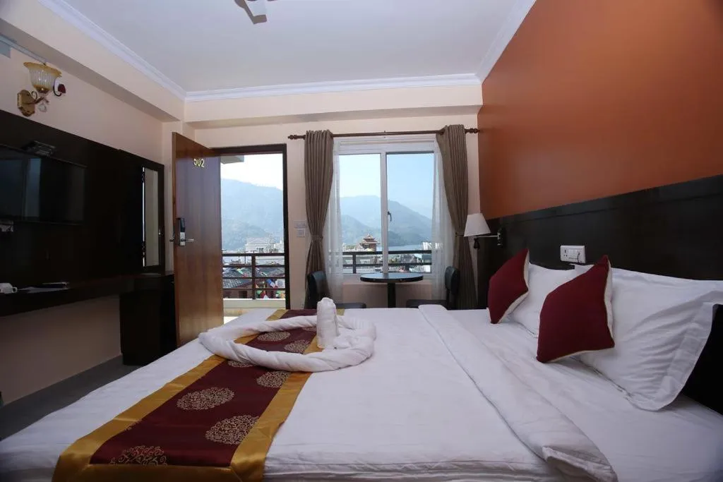 Communal lounge/ TV room, Bed in Hotel Eco Tree Pokhara