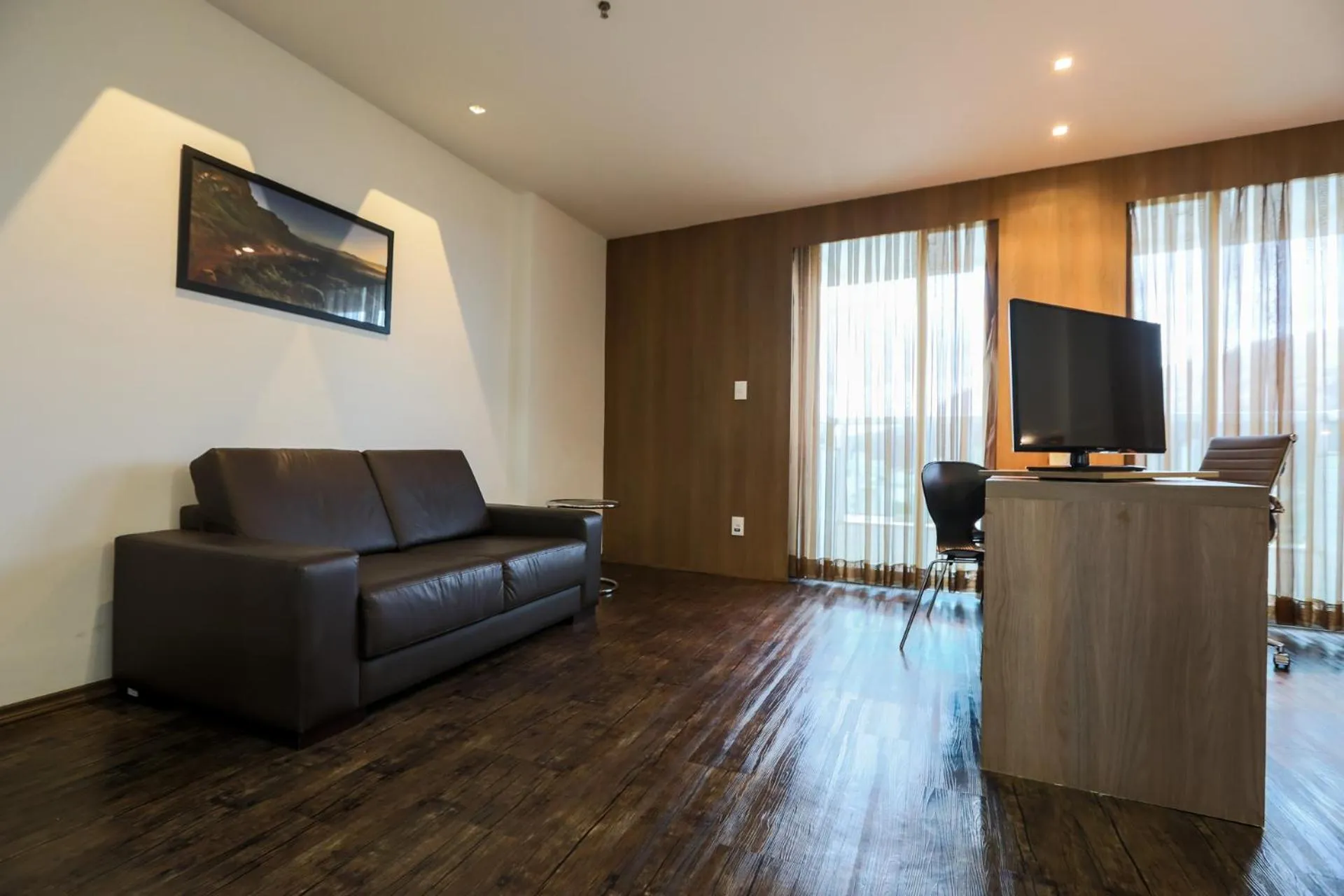 Communal lounge/ TV room in San Diego Suítes Governador Valadares