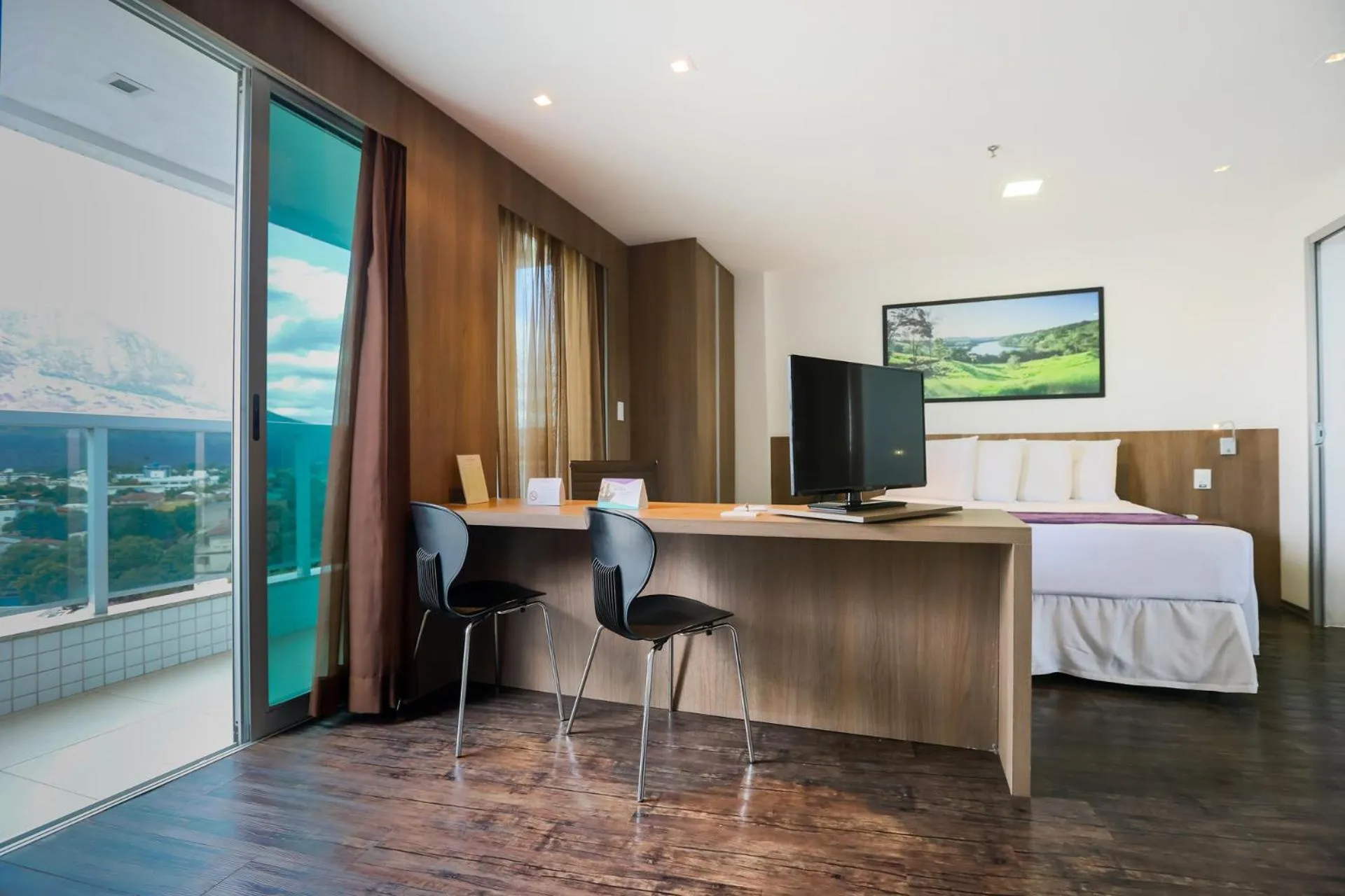 Communal lounge/ TV room, Bed in San Diego Suítes Governador Valadares