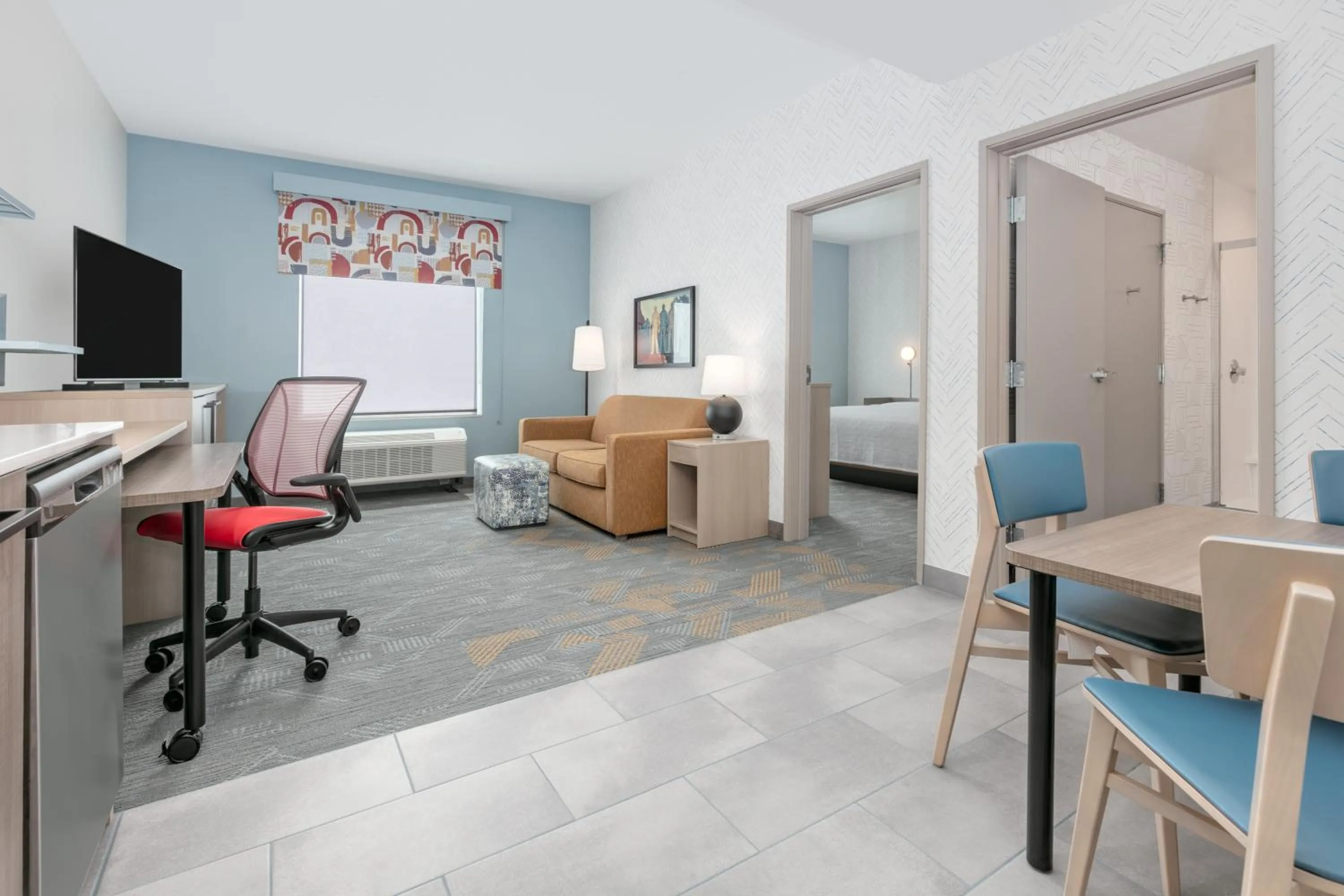 Living room, Bed in Home2 Suites By Hilton Huntsville, Tx