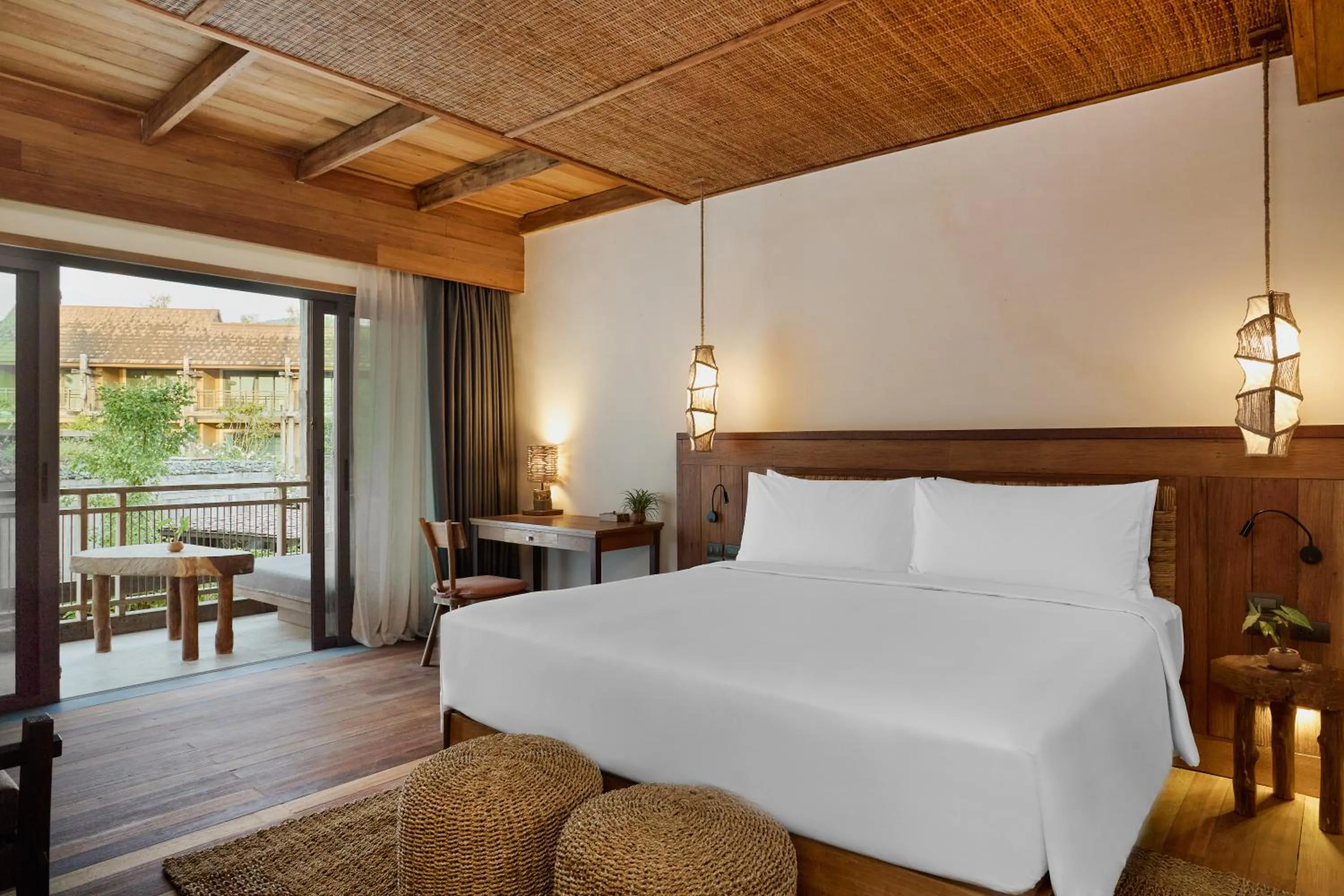 Bed in Vignette Collection Dinso Resort & Villas Ko Chang by IHG