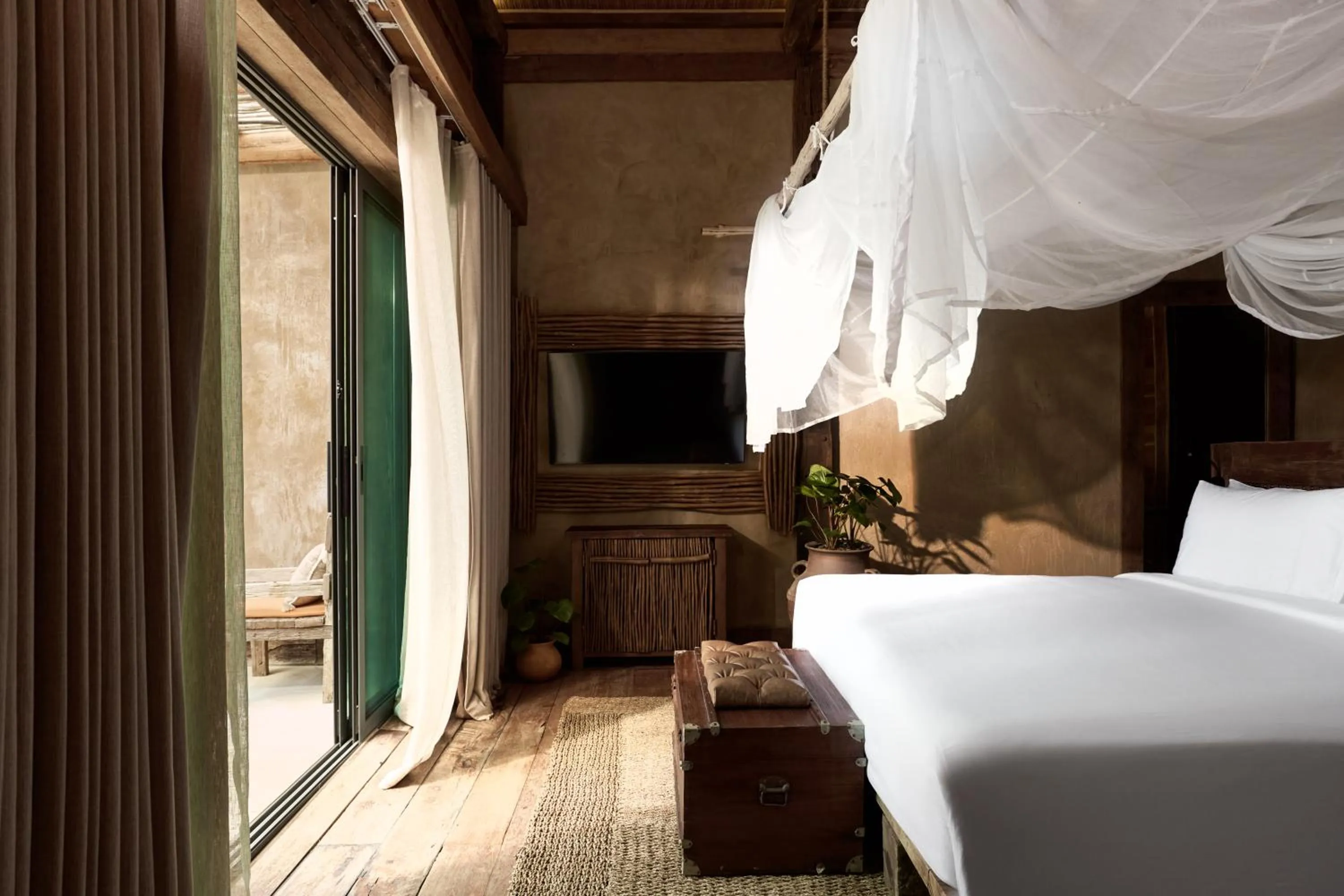 Bed in Vignette Collection Dinso Resort & Villas Ko Chang by IHG