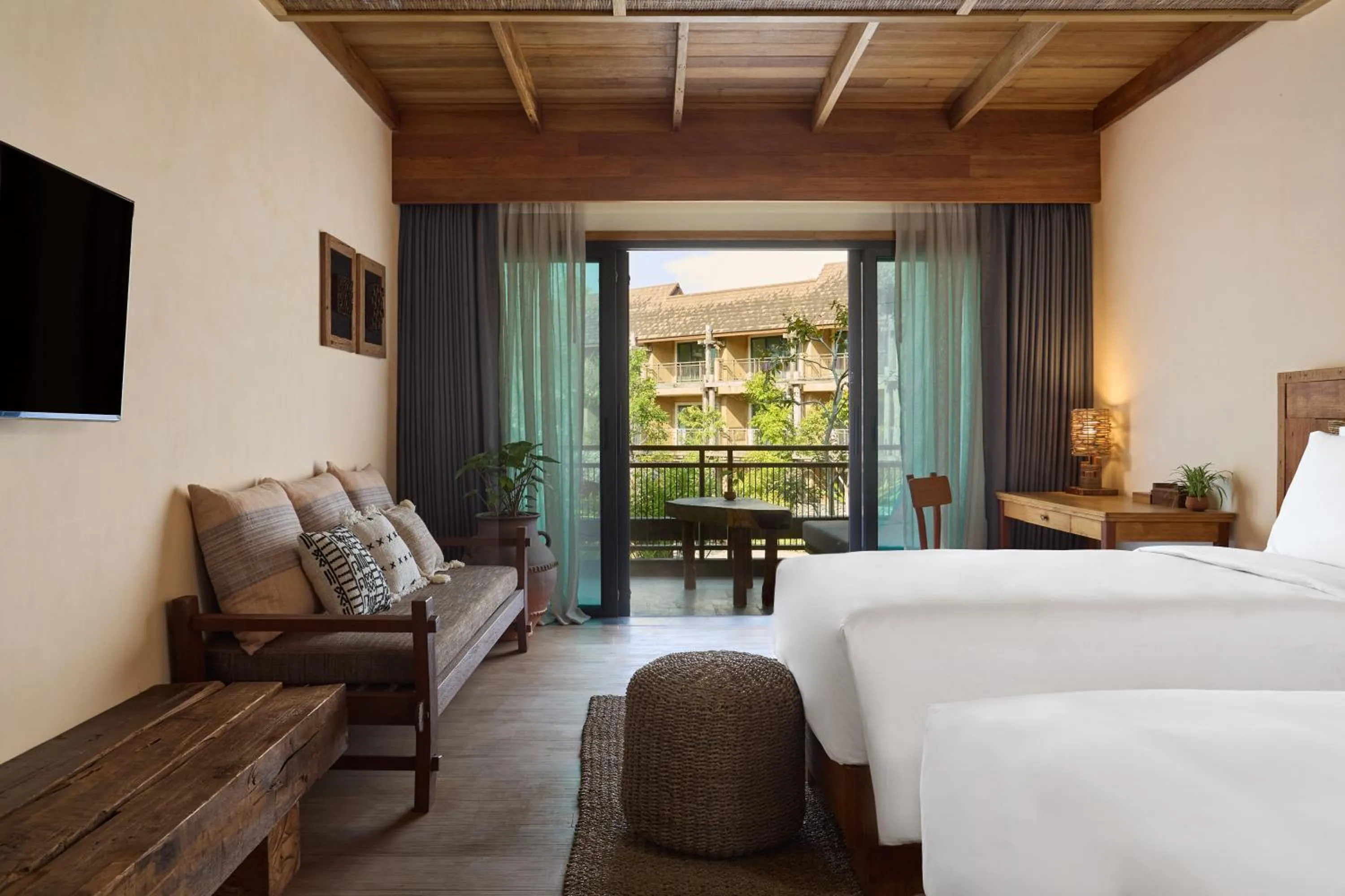 Bed in Vignette Collection Dinso Resort & Villas Ko Chang by IHG