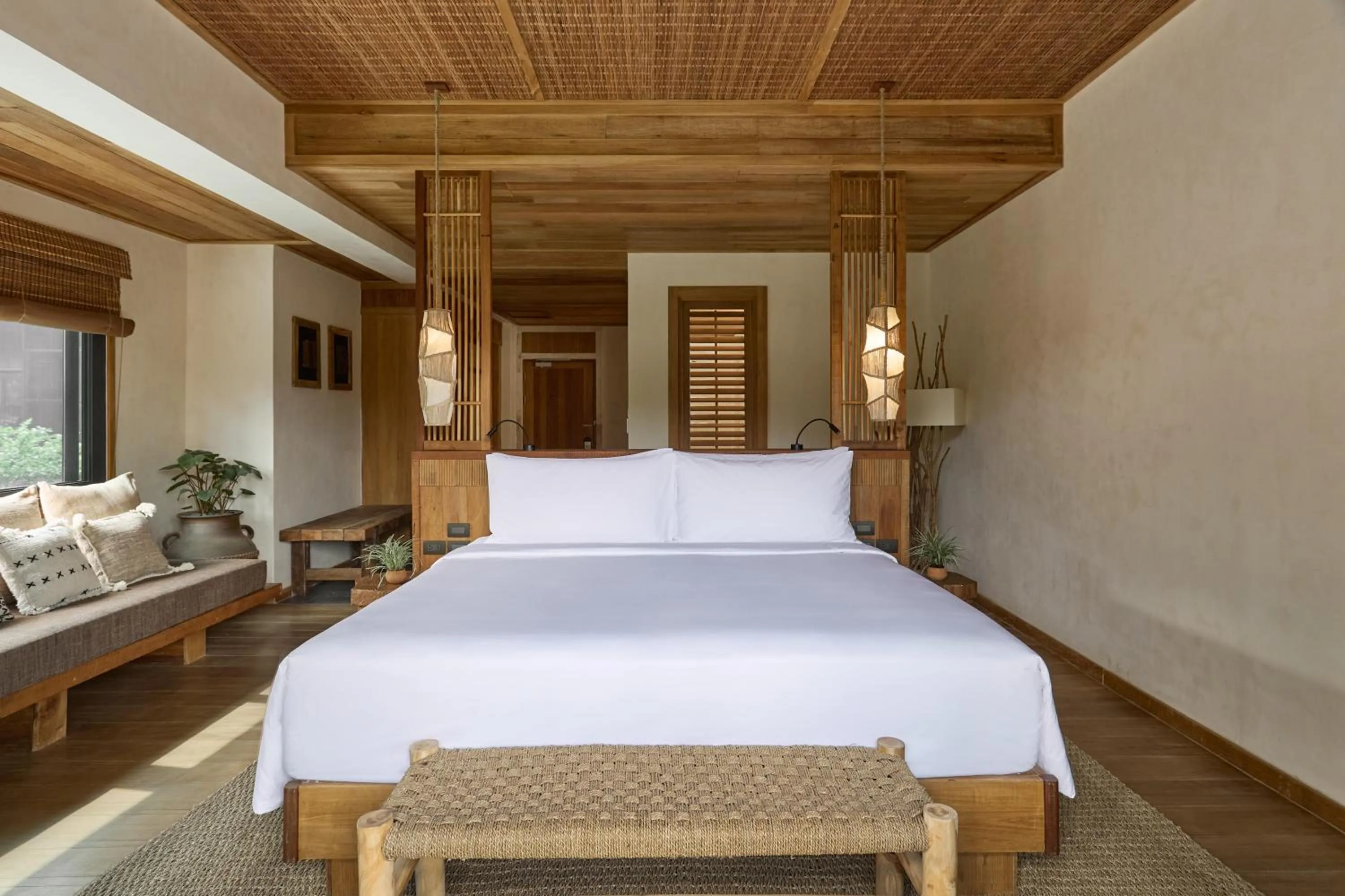 Bed in Vignette Collection Dinso Resort & Villas Ko Chang by IHG