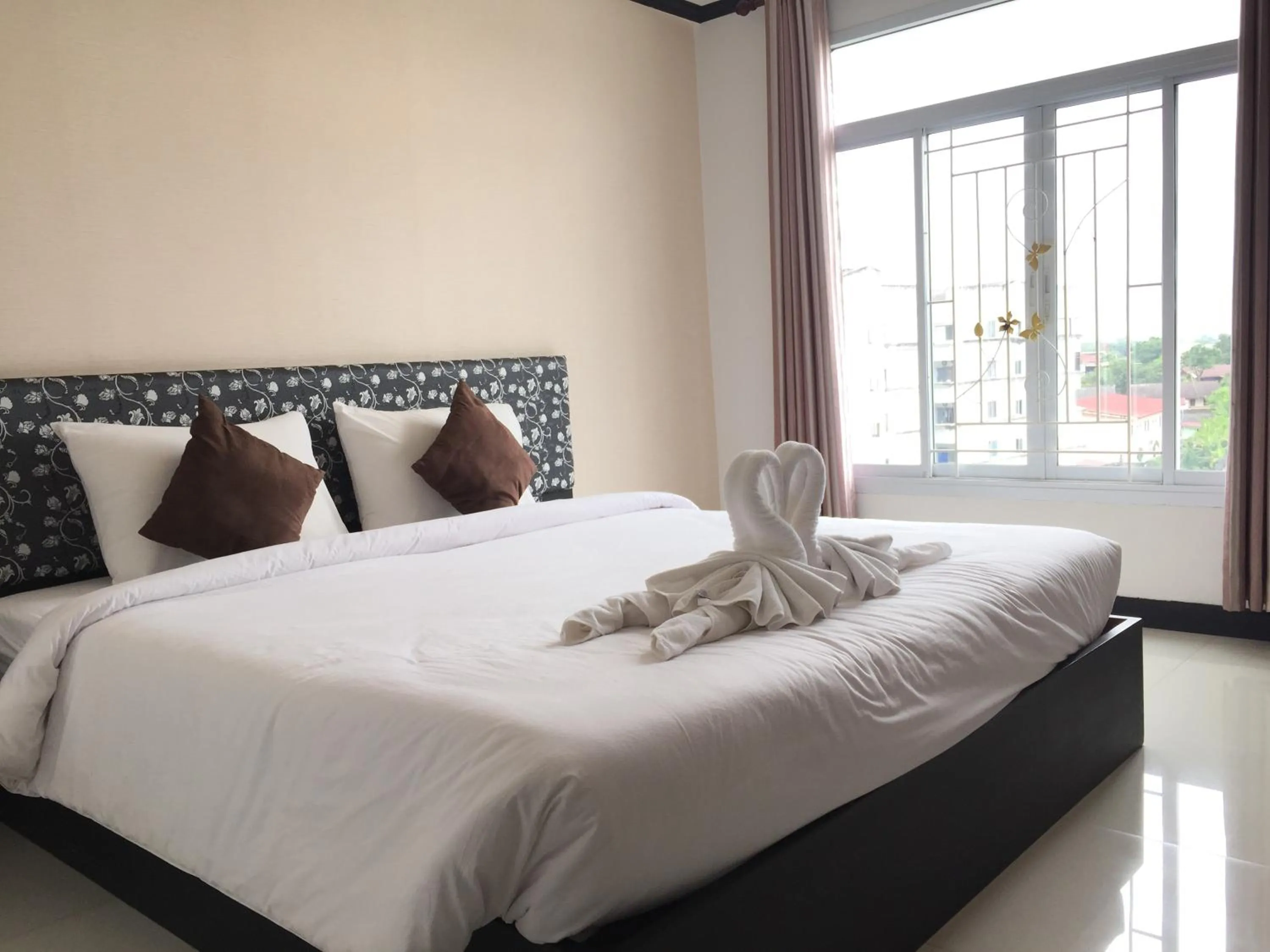 Bed in Leelawadee Grand Hotel