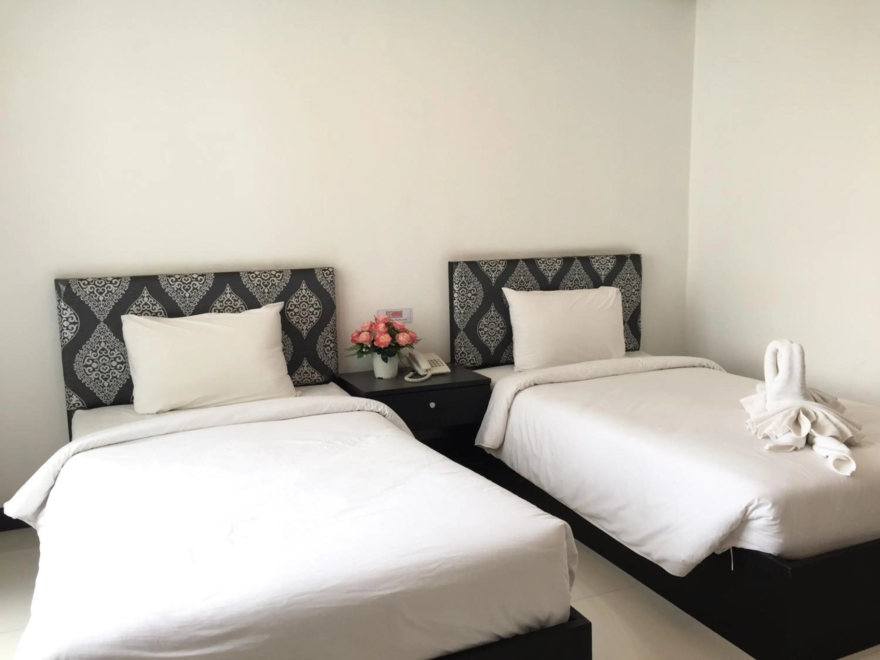 Bed in Leelawadee Grand Hotel