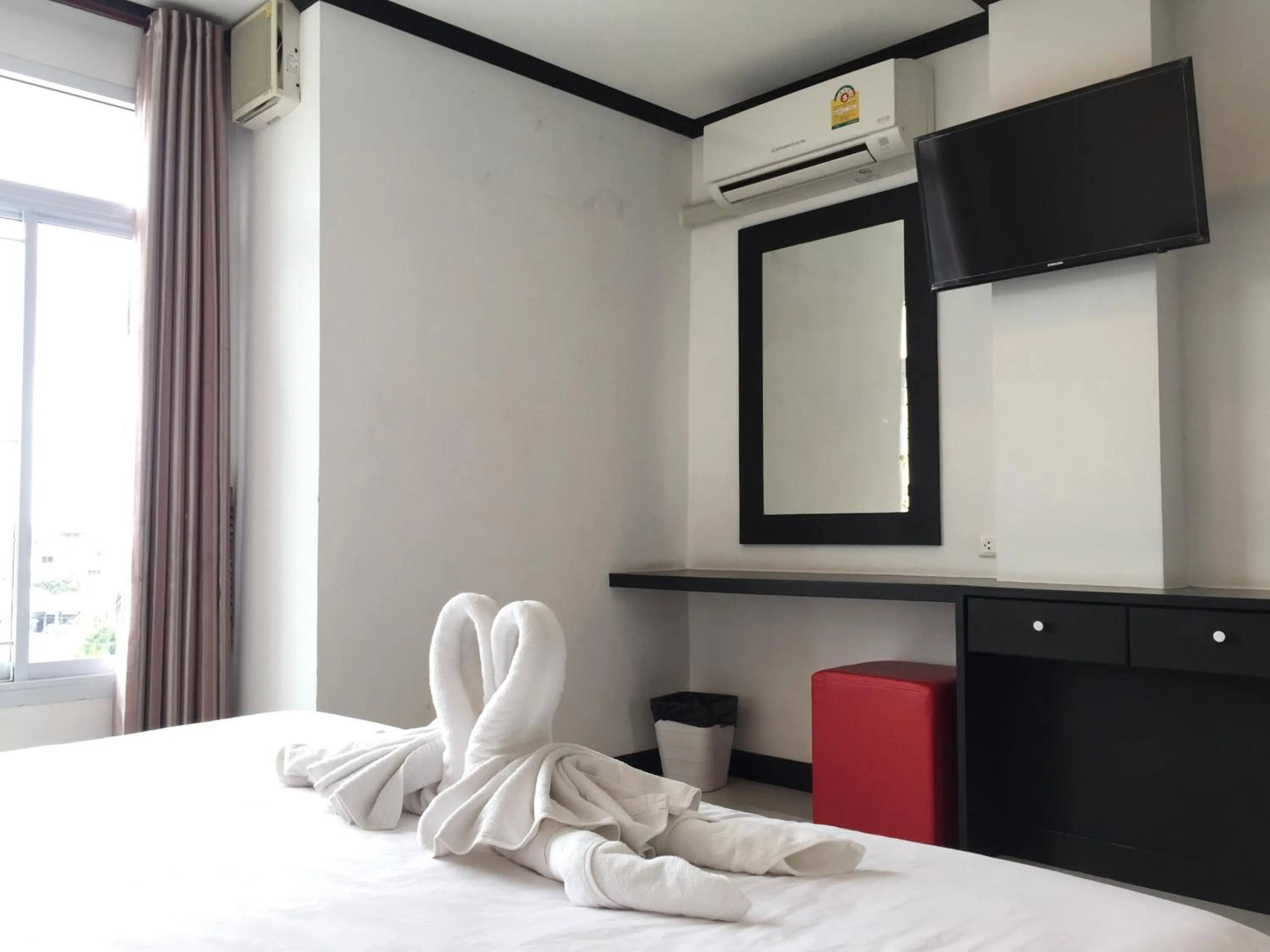 Bed in Leelawadee Grand Hotel