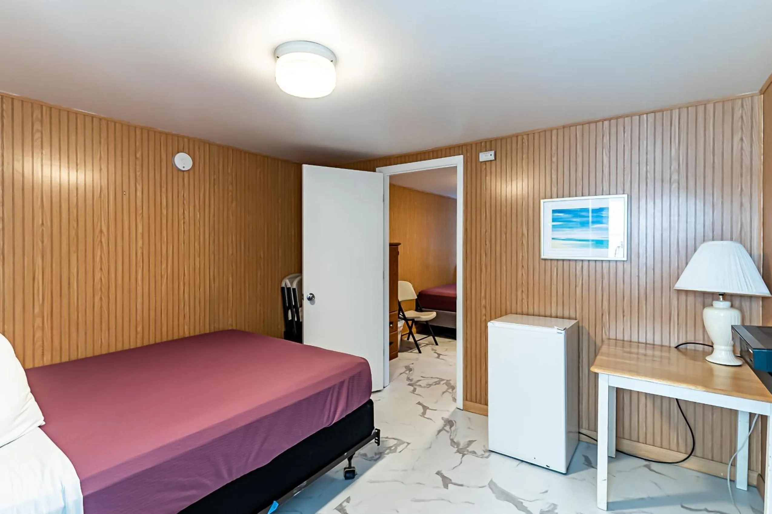 Bed in Boardwalk Sand & Surf Beach Hotel Oceanfront