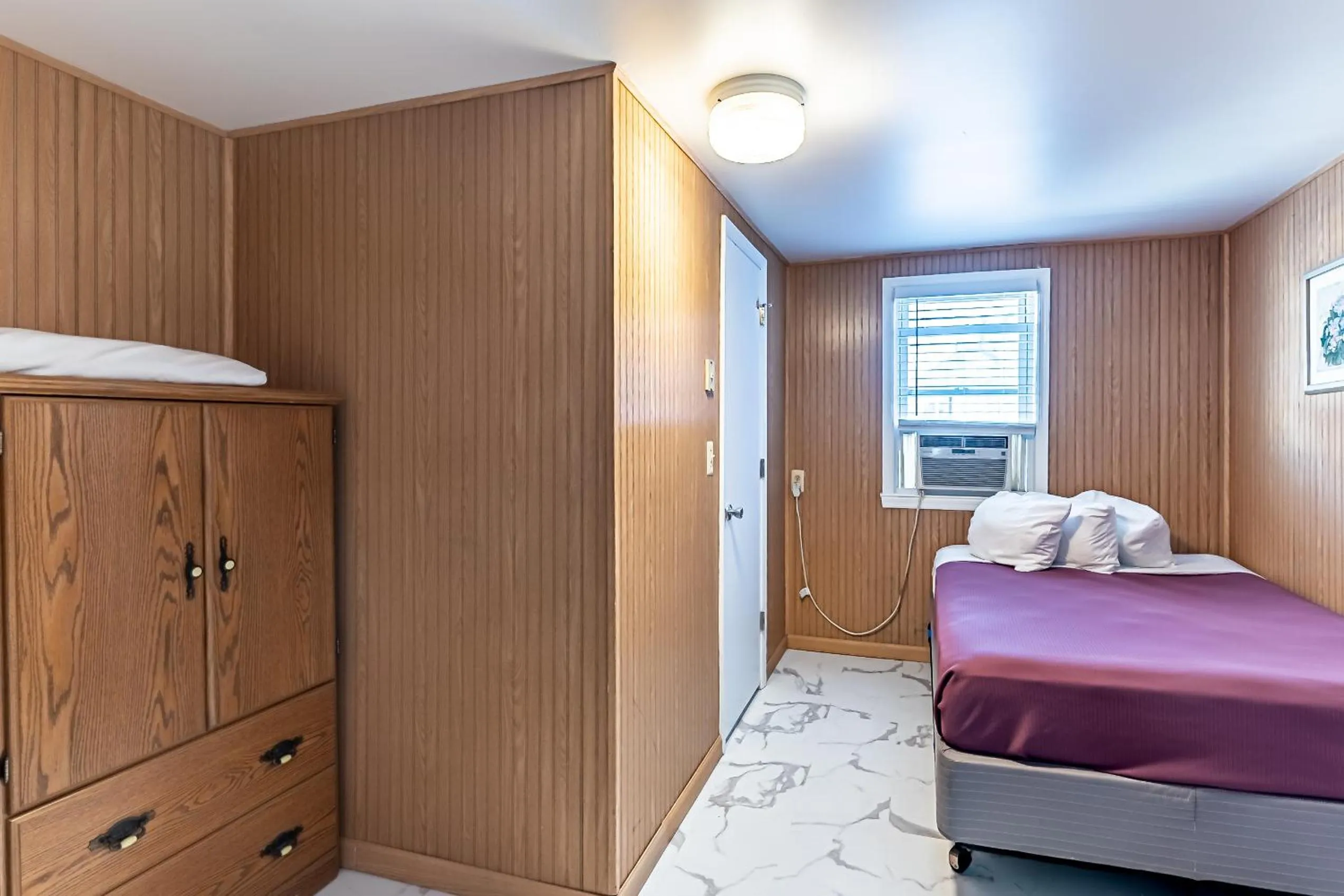 Bed in Boardwalk Sand & Surf Beach Hotel Oceanfront