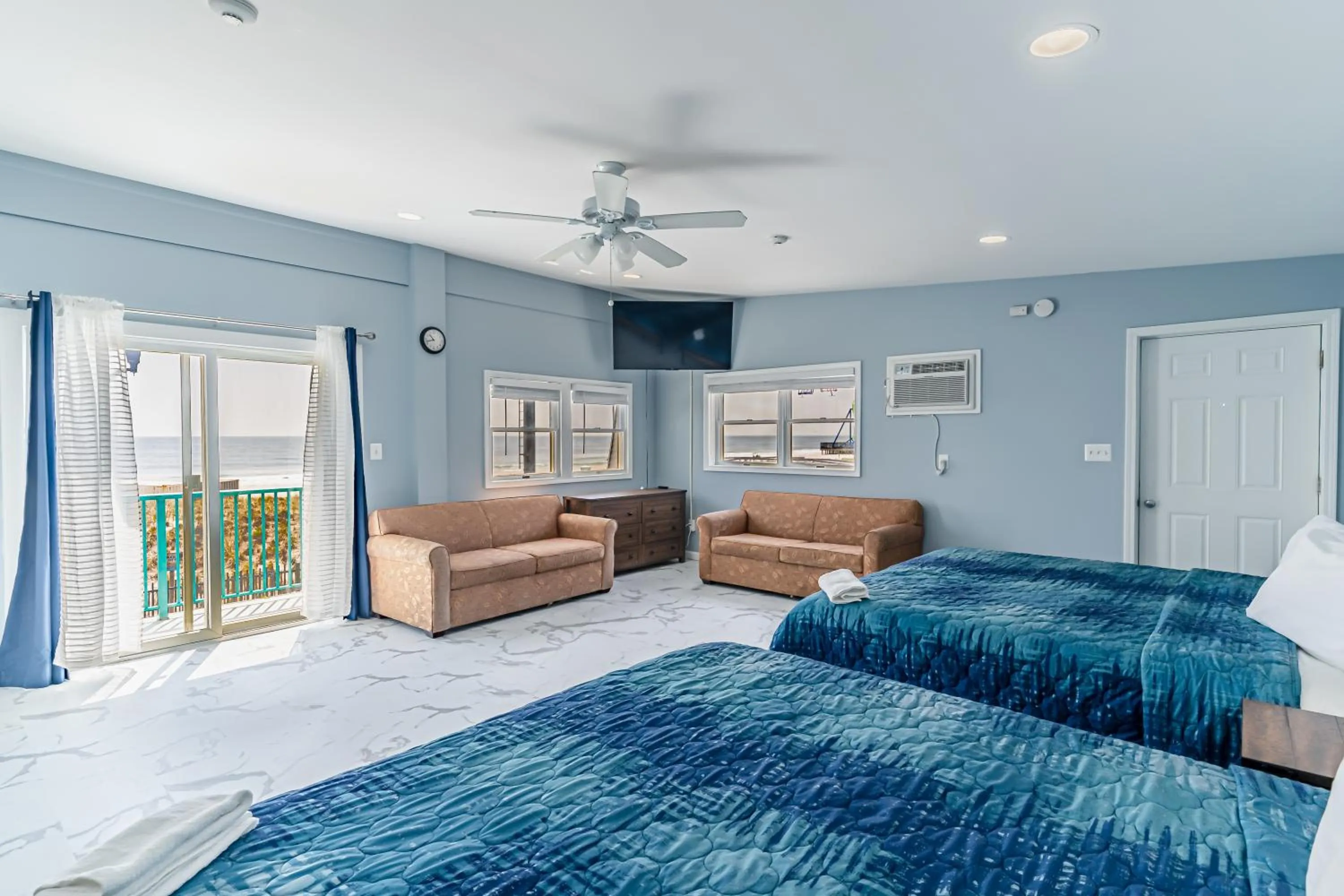 Bed in Boardwalk Sand & Surf Beach Hotel Oceanfront