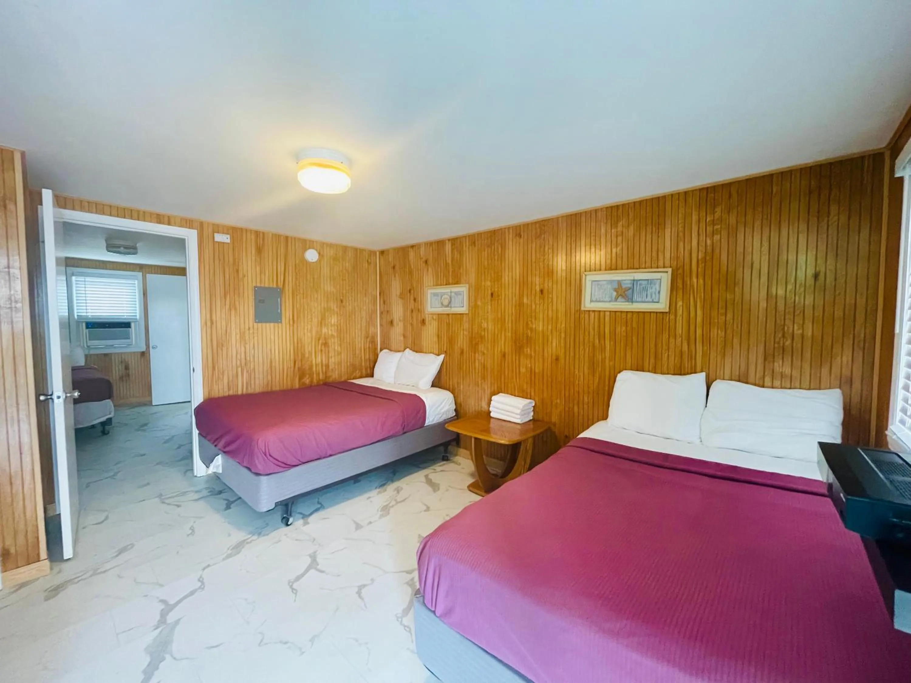 Bed in Boardwalk Sand & Surf Beach Hotel Oceanfront