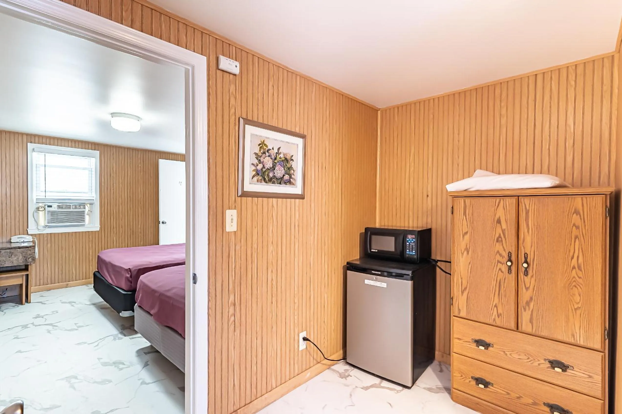 Bed in Boardwalk Sand & Surf Beach Hotel Oceanfront