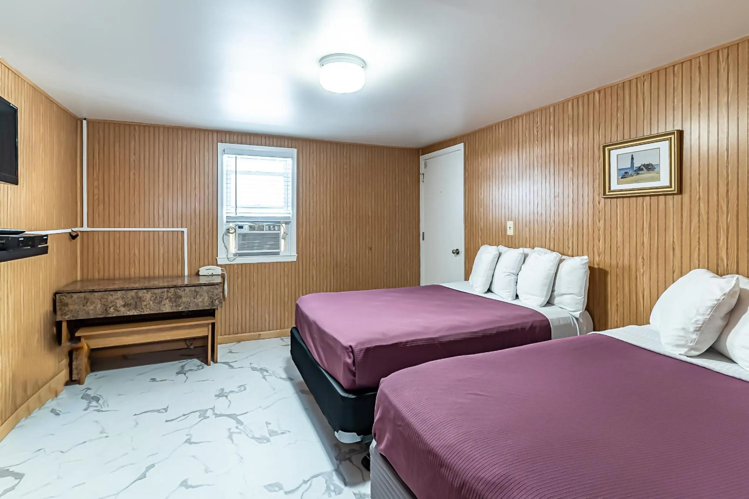 Bed in Boardwalk Sand & Surf Beach Hotel Oceanfront