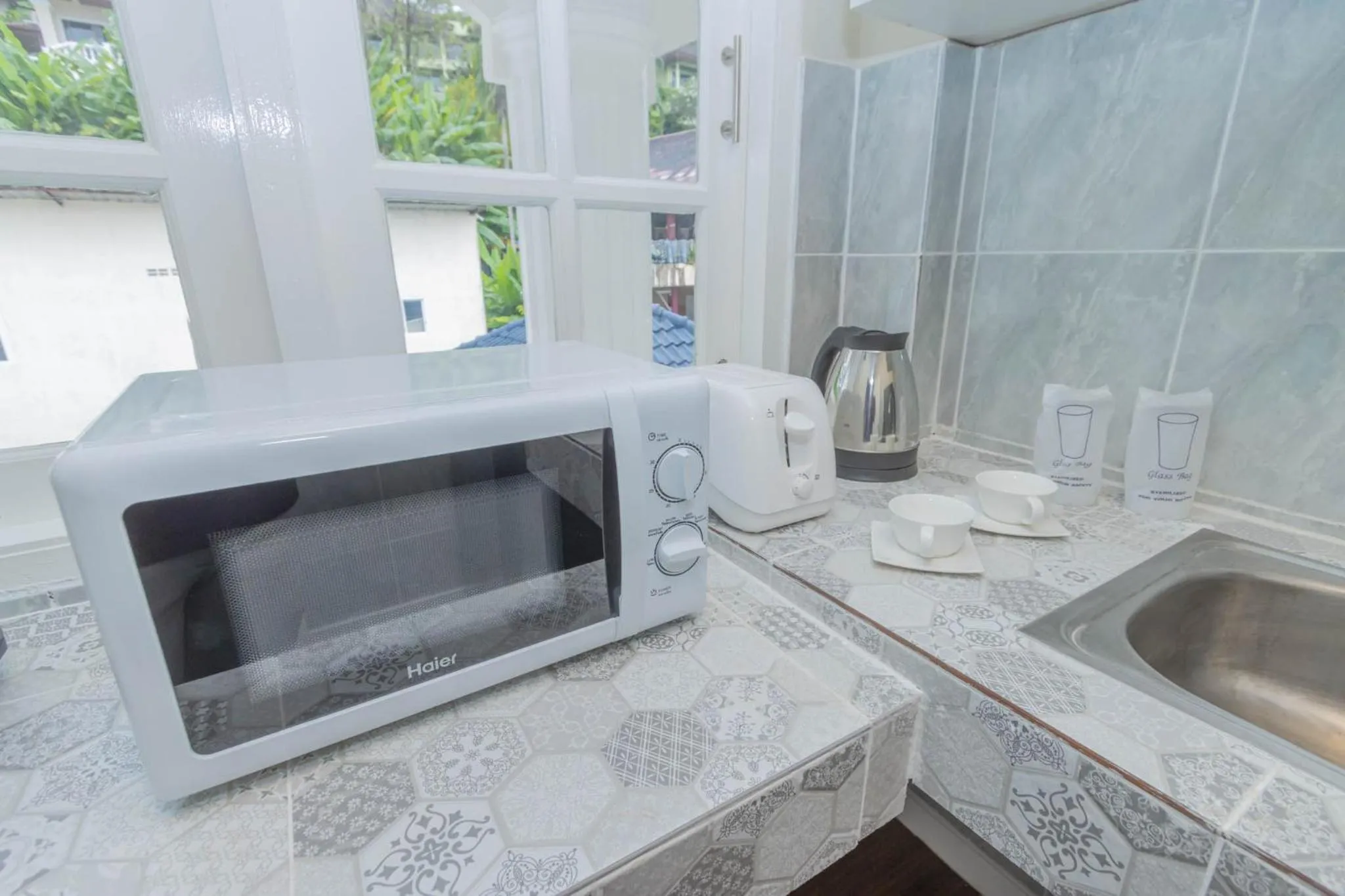 Kitchen or kitchenette in RoomQuest The Peak Patong Hill