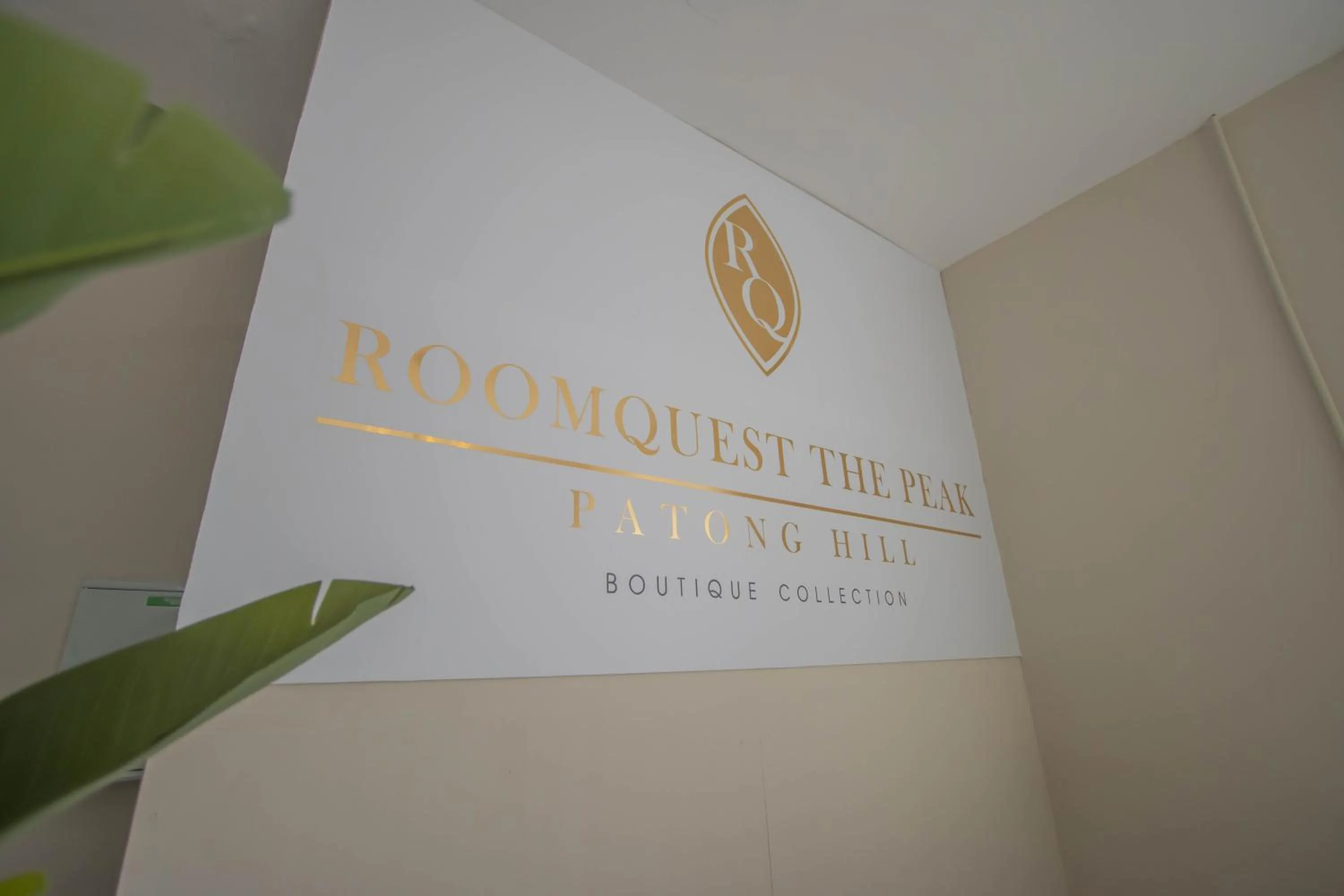 Property logo or sign in RoomQuest The Peak Patong Hill