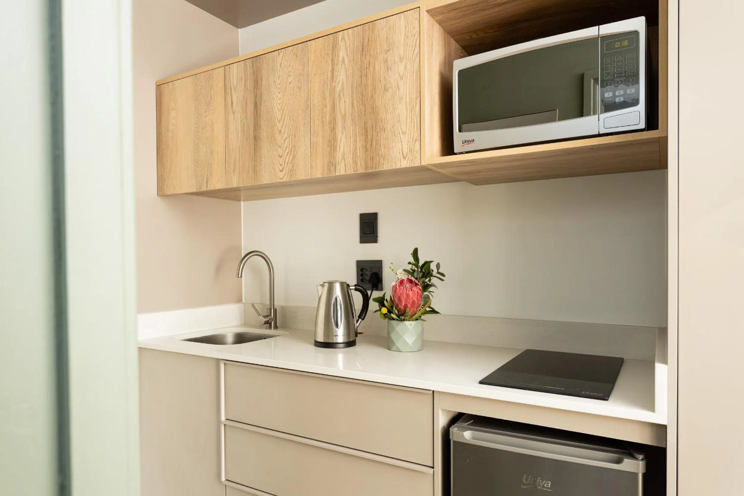 Kitchen or kitchenette in Habitat Aparthotel by Totalstay