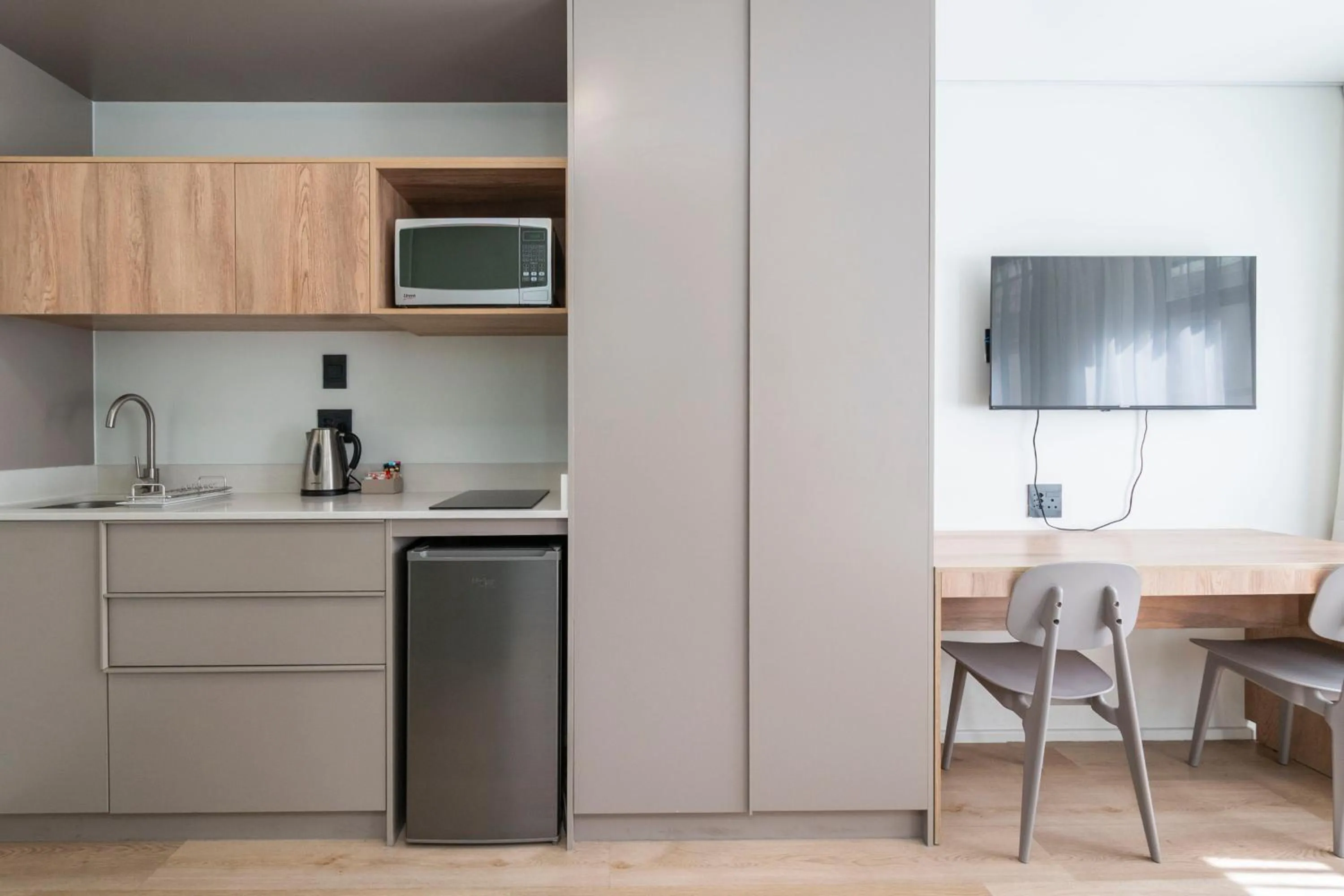 Kitchen or kitchenette in Habitat Aparthotel by Totalstay