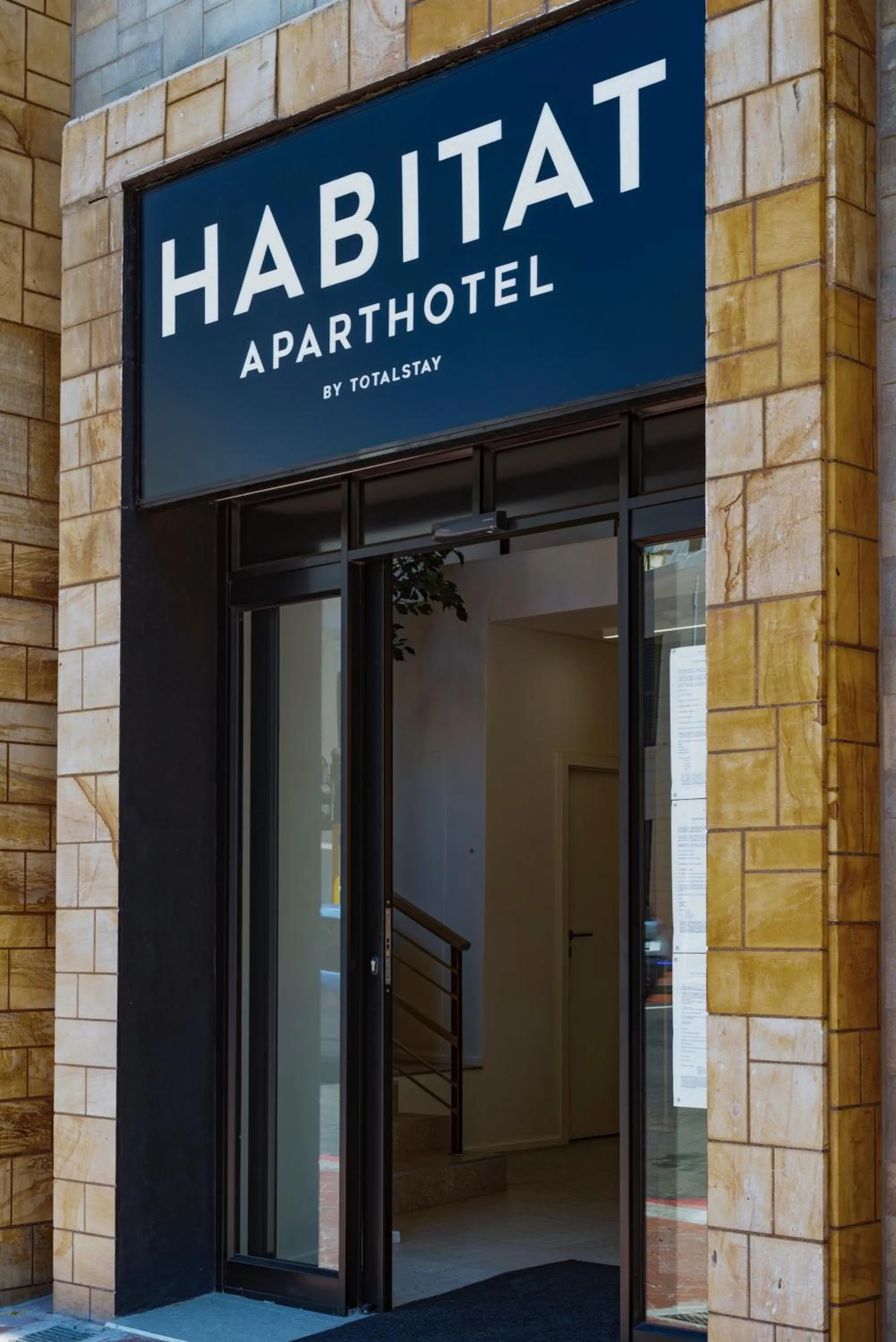 Facade/entrance in Habitat Aparthotel by Totalstay