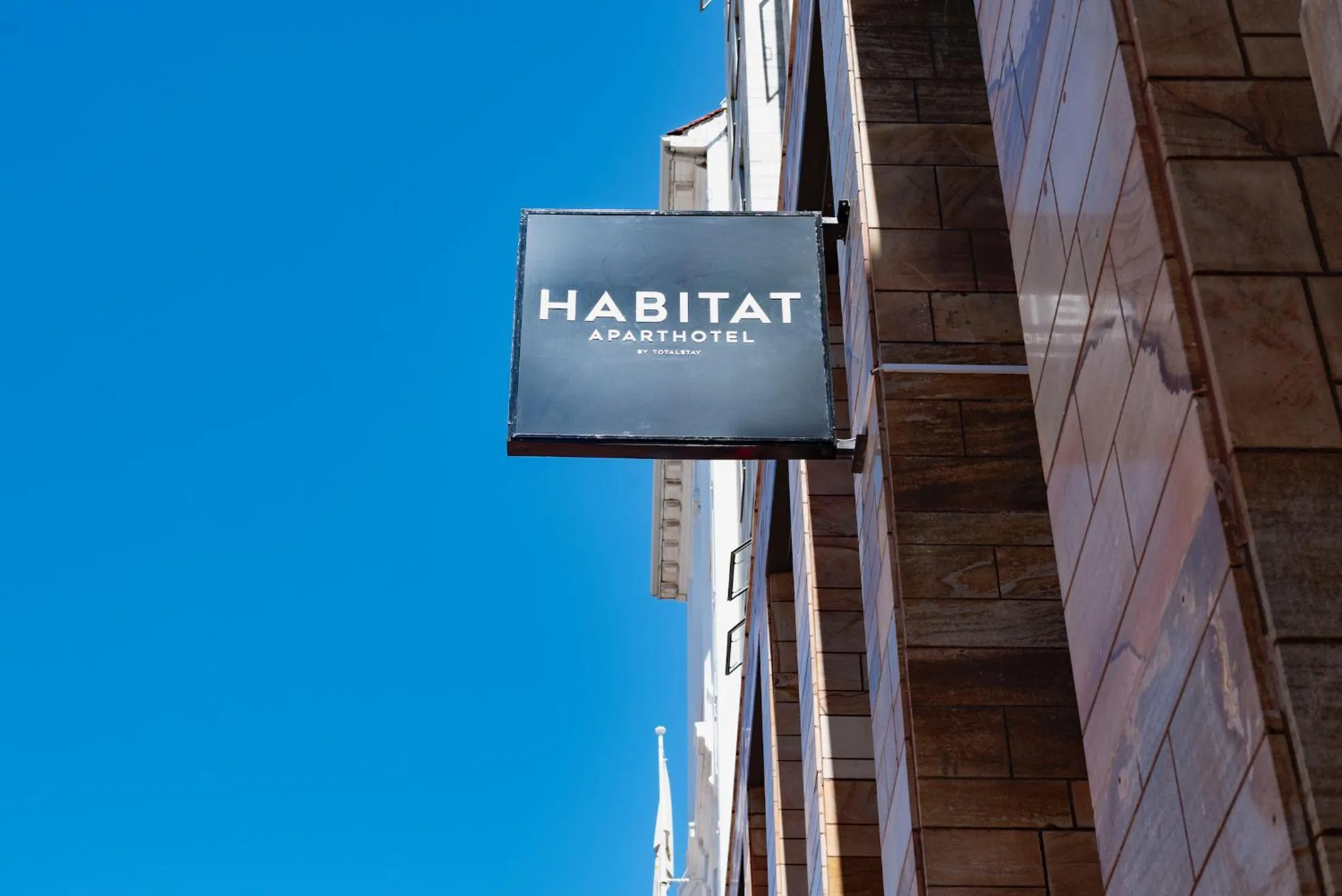 Property logo or sign in Habitat Aparthotel by Totalstay