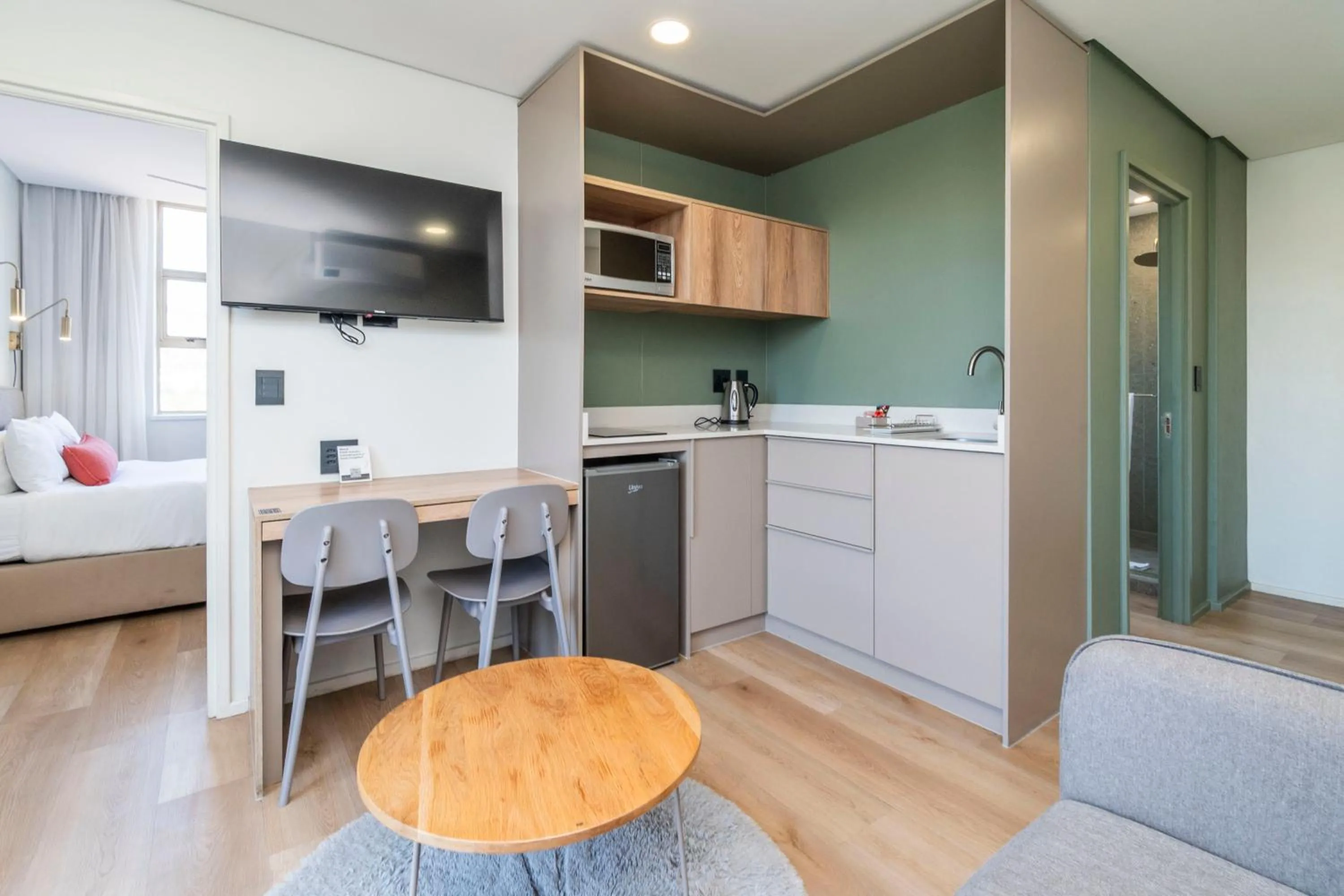 Kitchen or kitchenette in Habitat Aparthotel by Totalstay