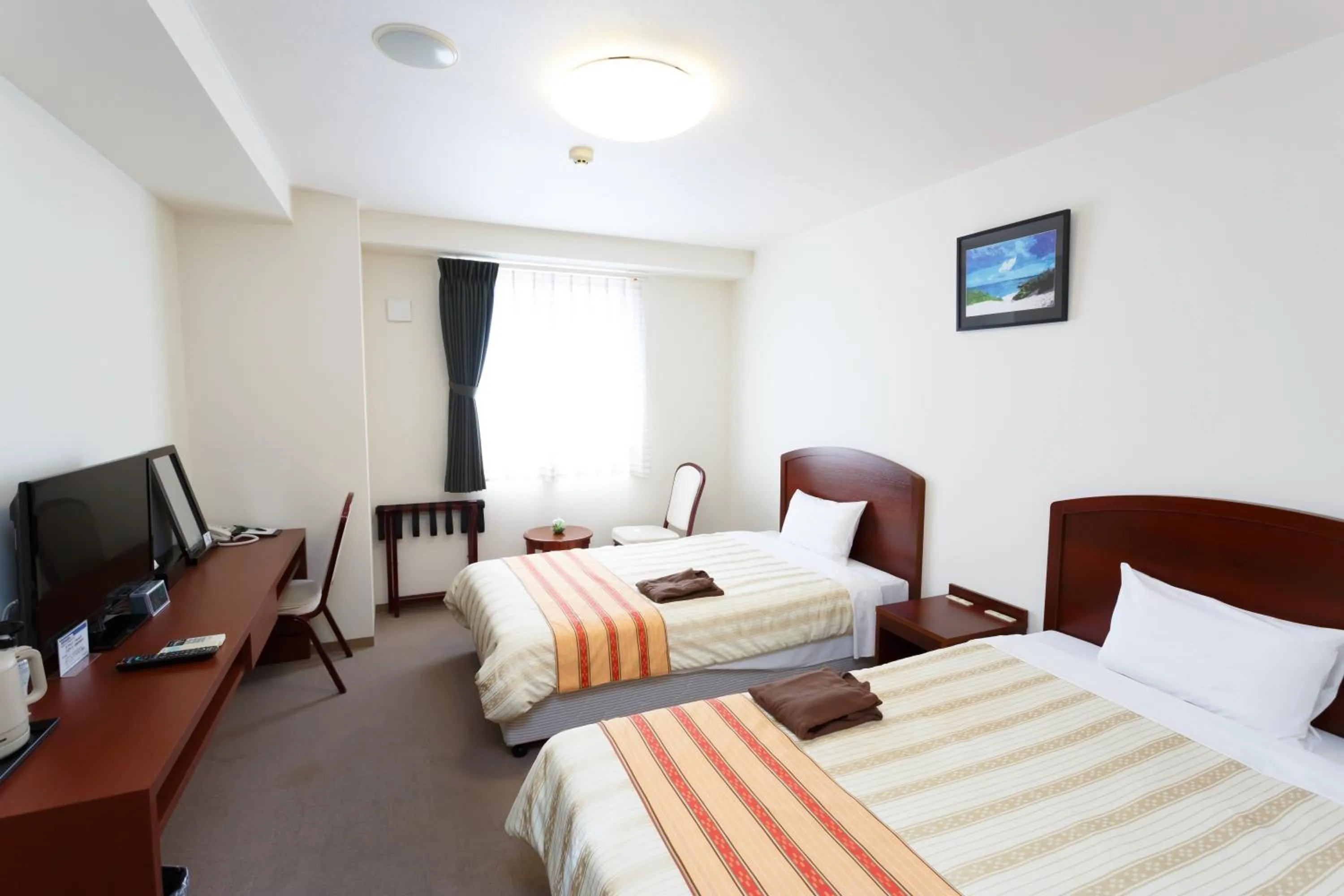 Photo of the whole room, Bed in Hotel Peace Island Miyakojima Shiyakusho Tori