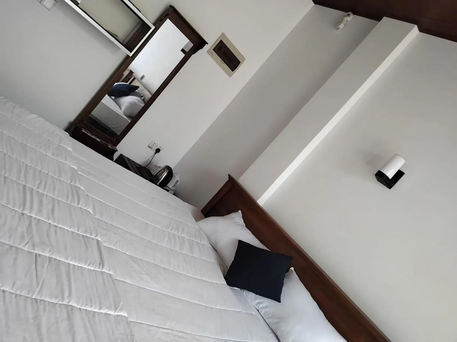 Bed in Esha Beach Resort Rooms