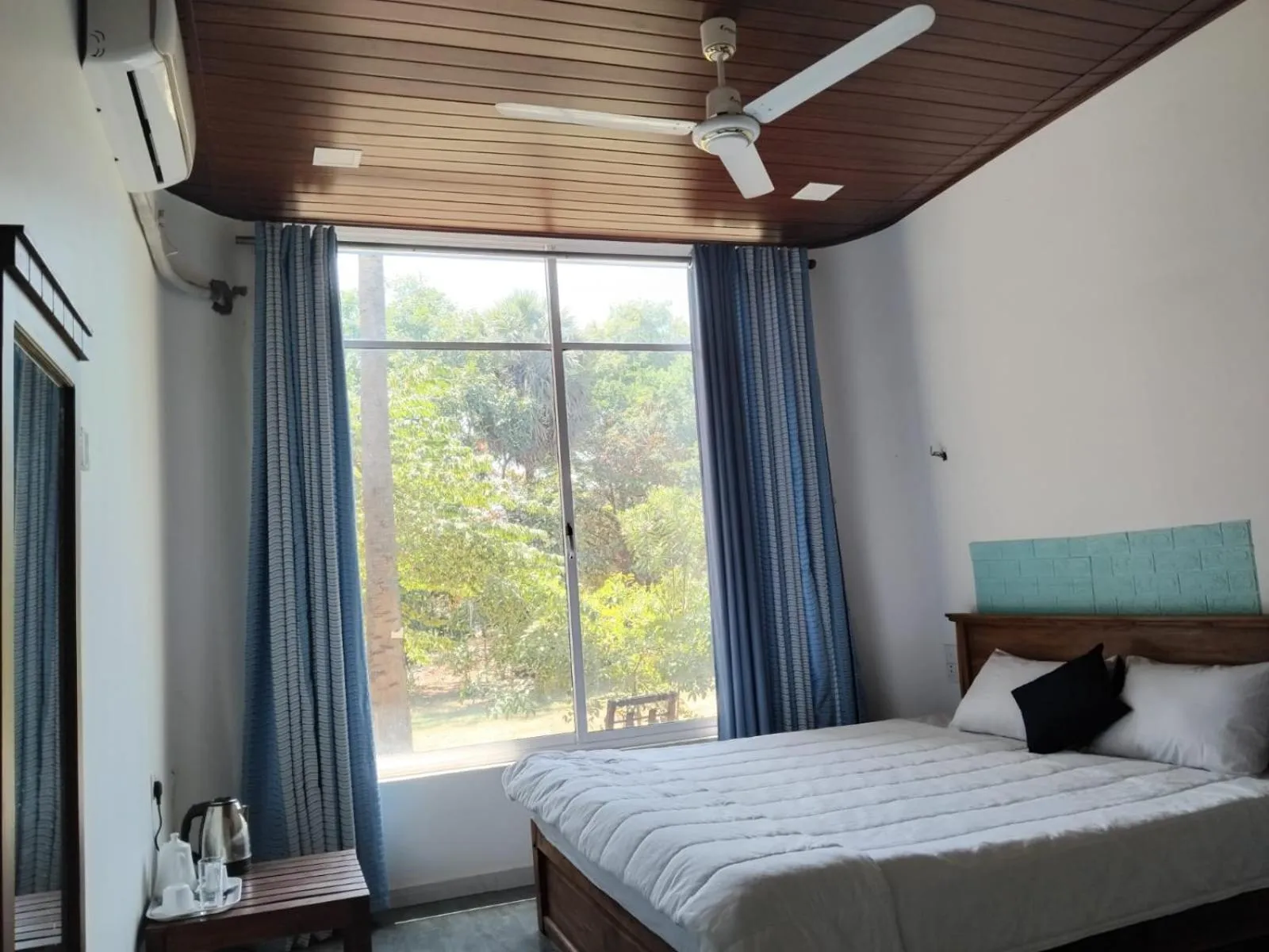 Bed in Esha Beach Resort Rooms