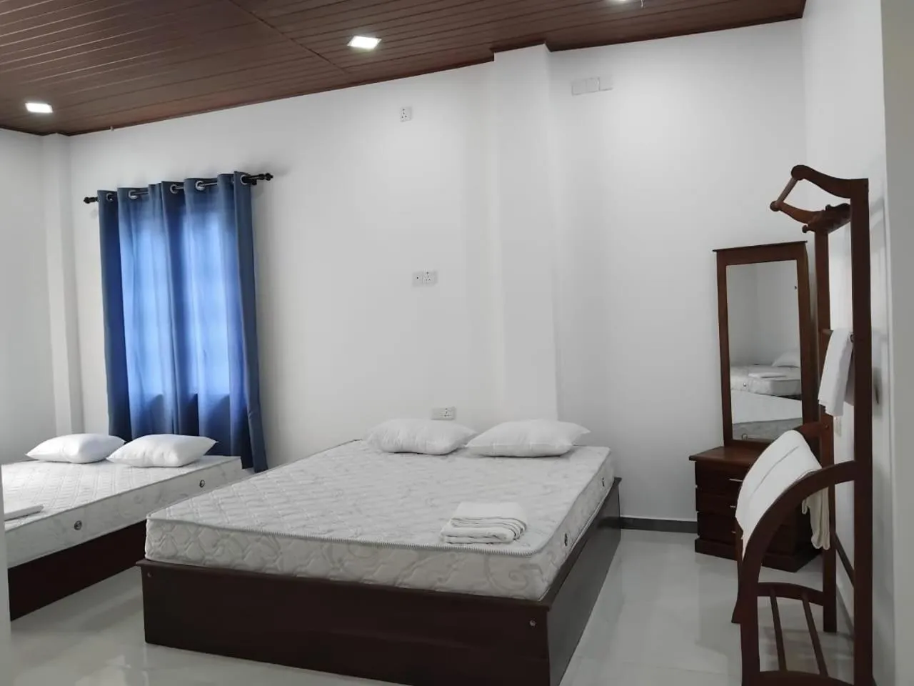 Bed in Esha Beach Resort Rooms