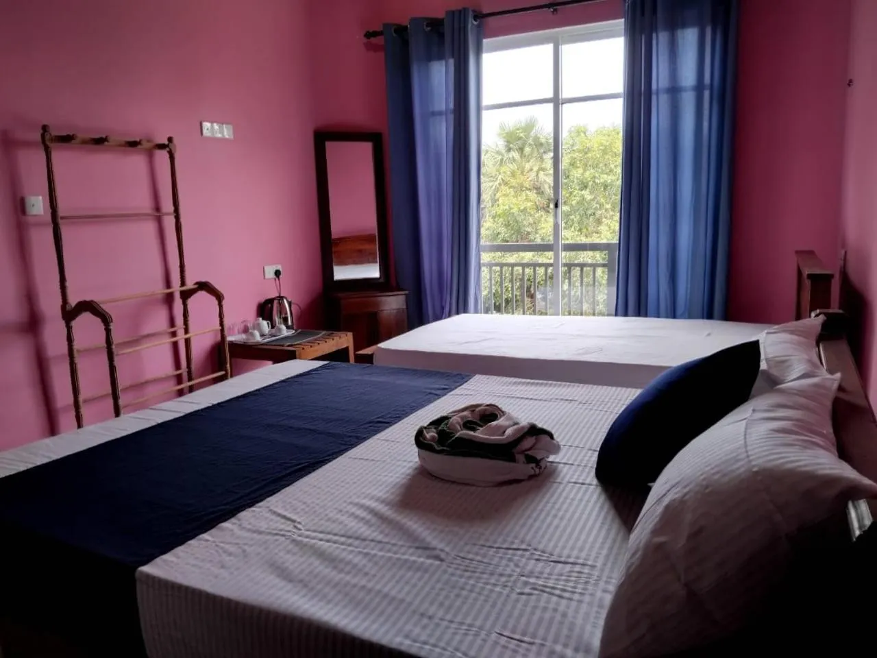 Bed in Esha Beach Resort Rooms