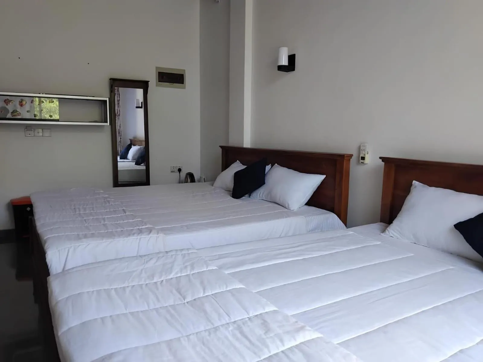 Bed in Esha Beach Resort Rooms