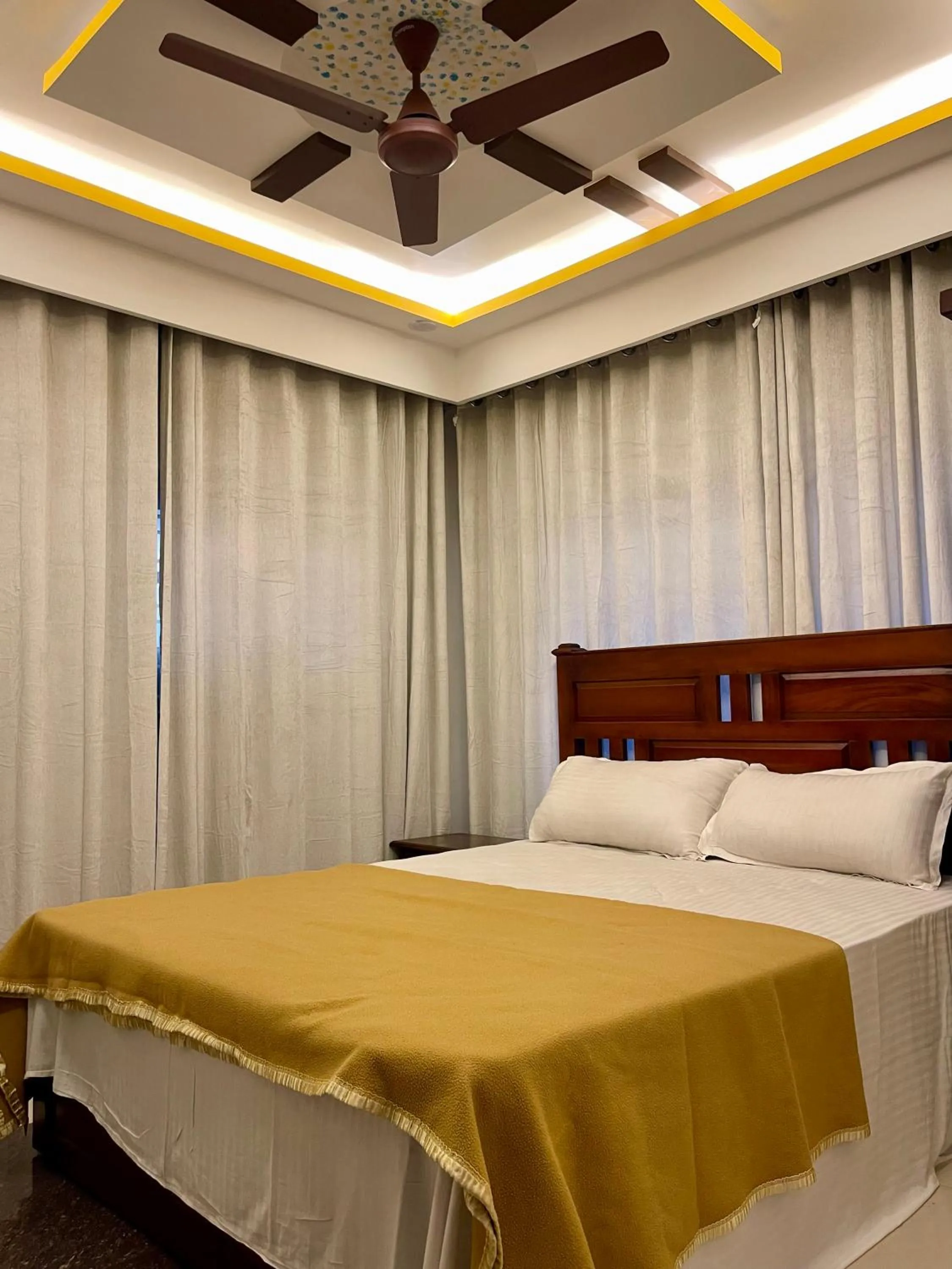 Bed in Puthookkadans Mareena Lodge