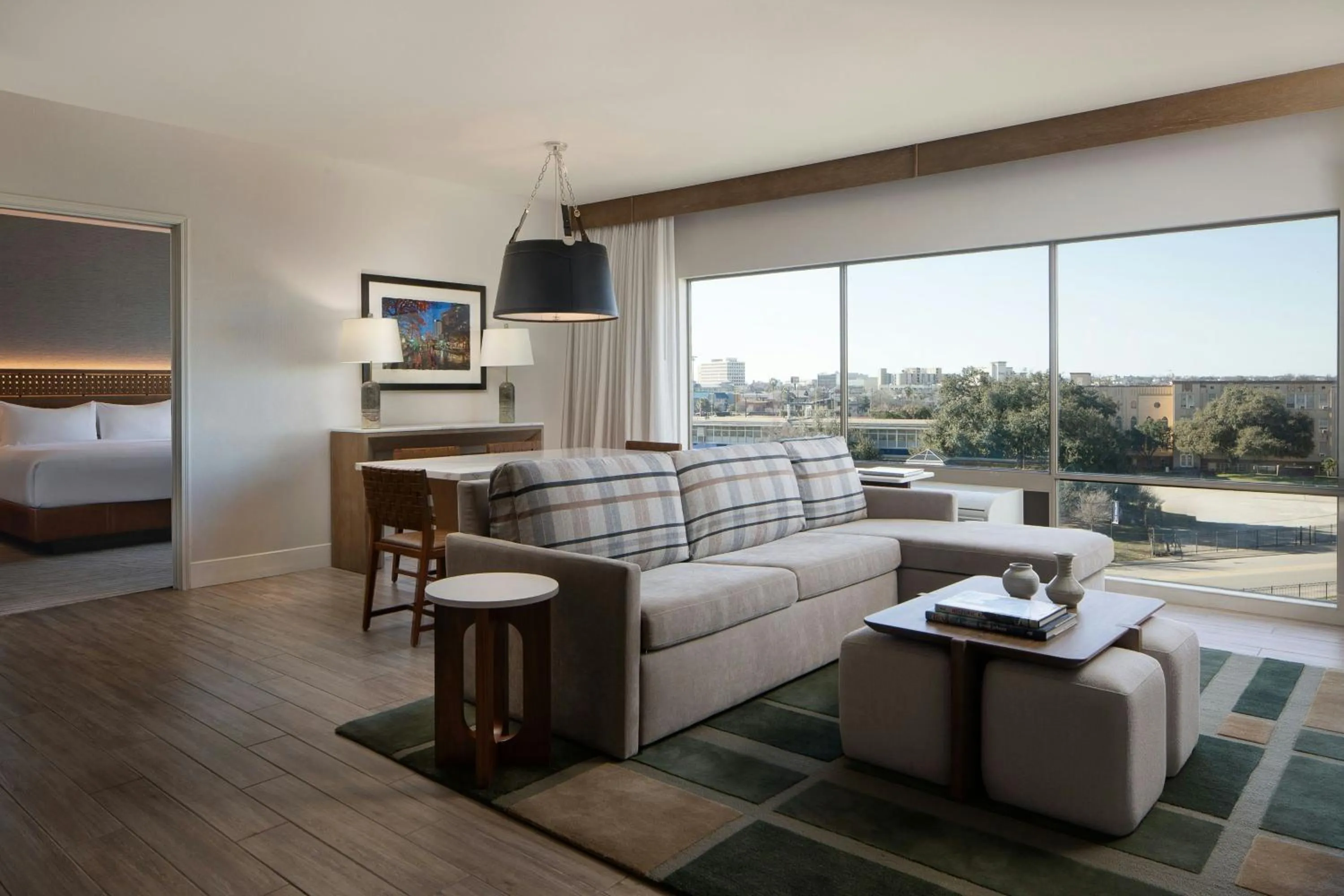 Living room, Bed in Sol Cypress, San Antonio, a Tribute Portfolio Hotel