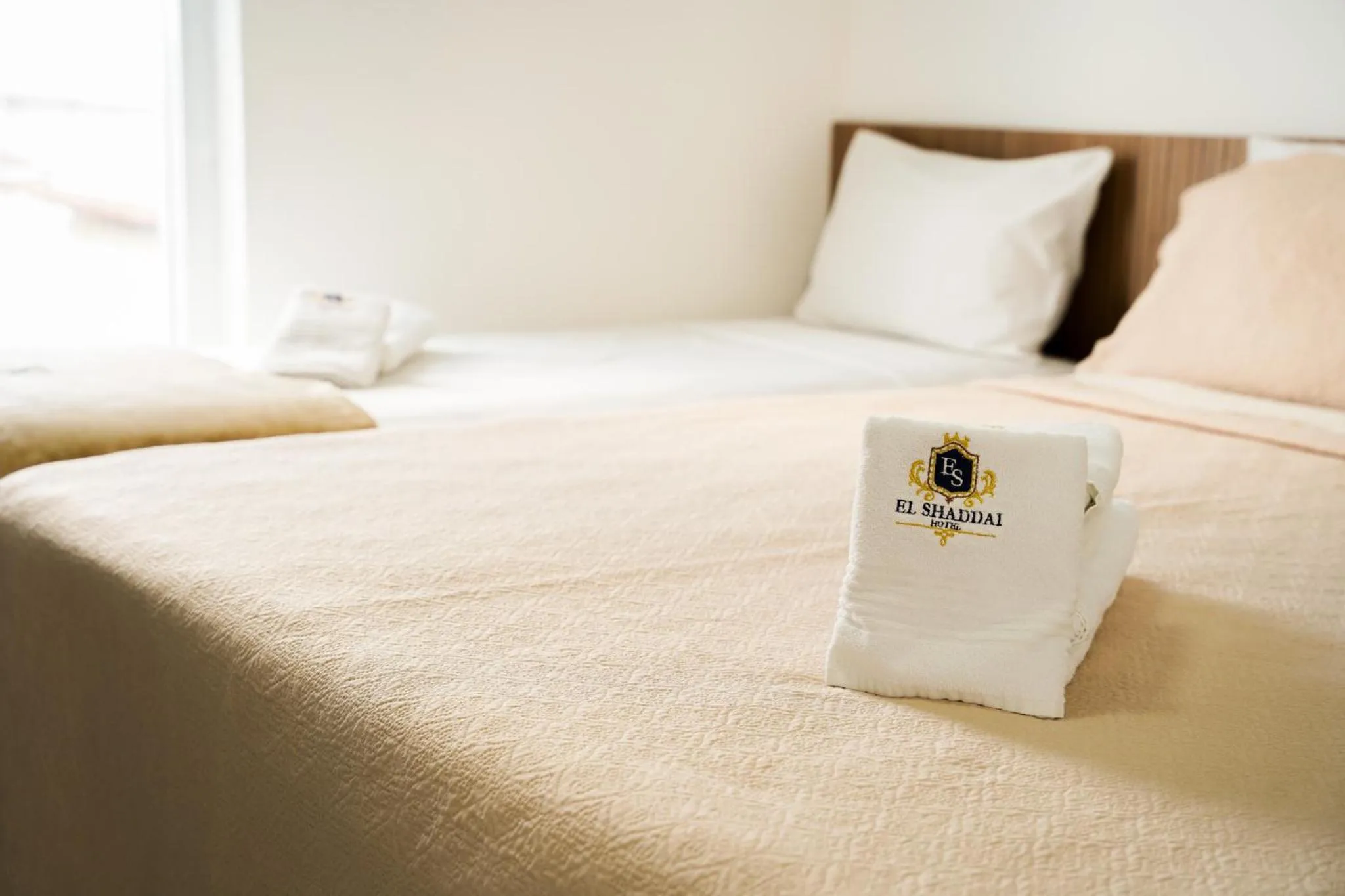 Bed in EL SHADDAI HOTEL