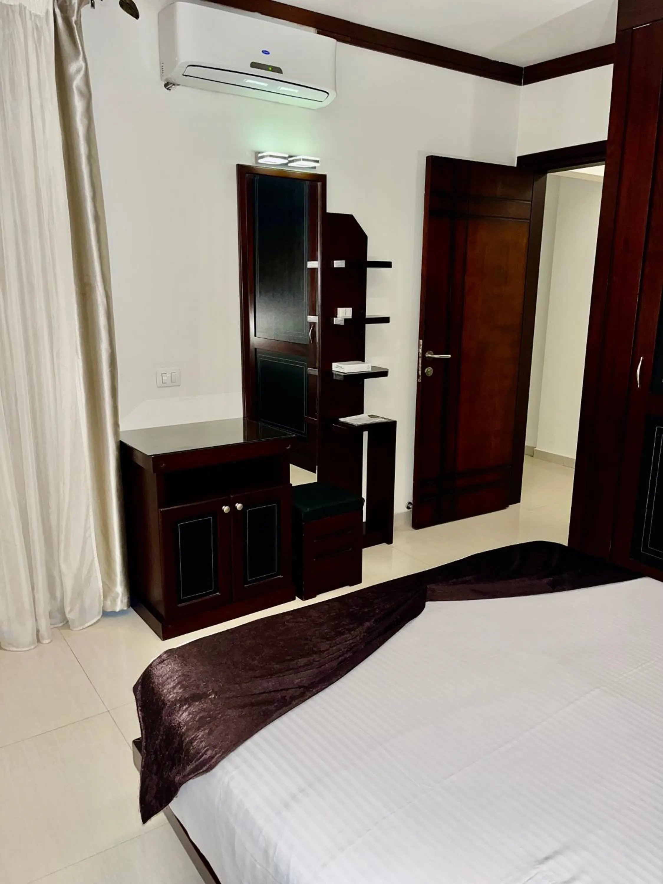 Bed in Panacea Suites Hotel