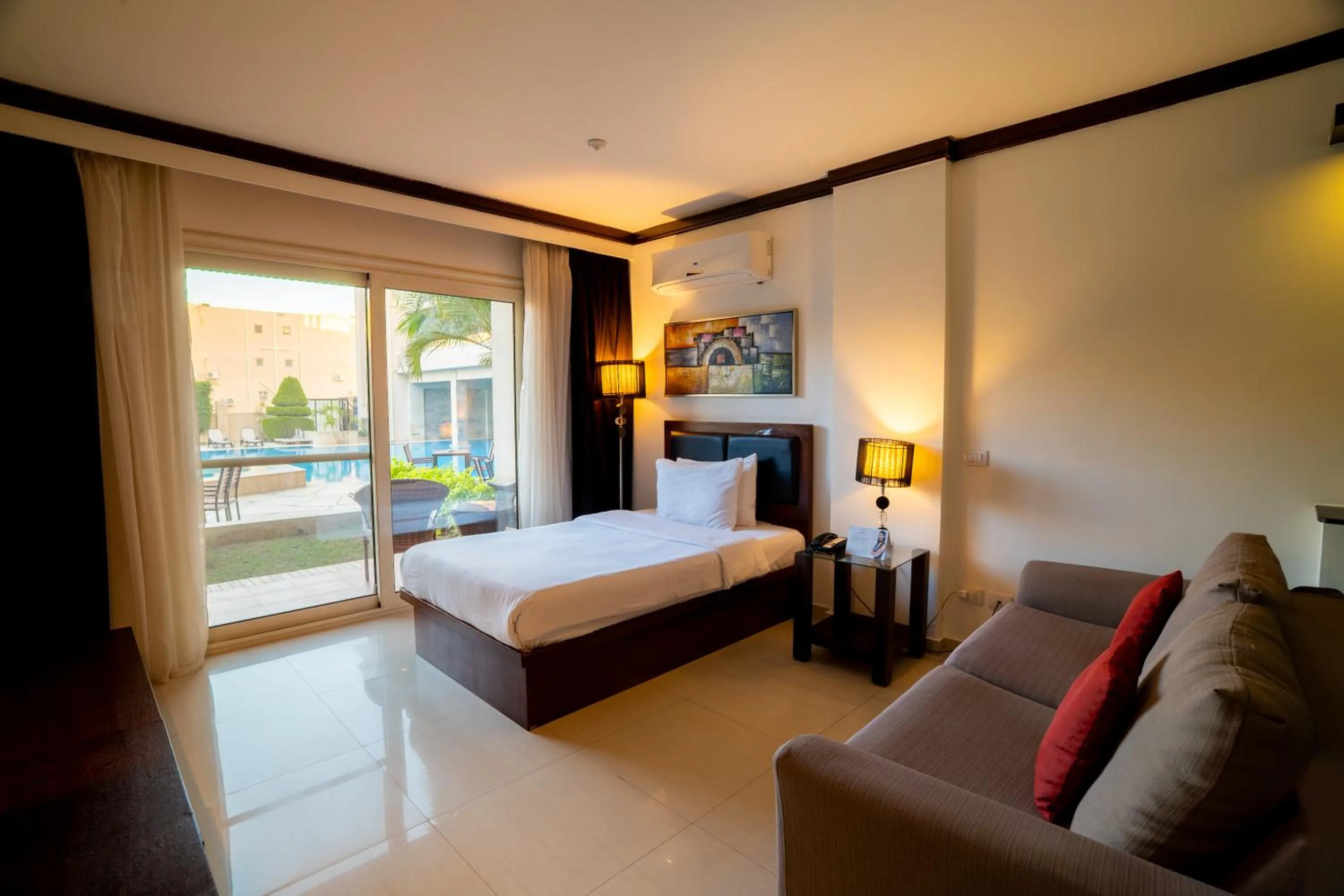 Bedroom, Bed in Panacea Suites Hotel