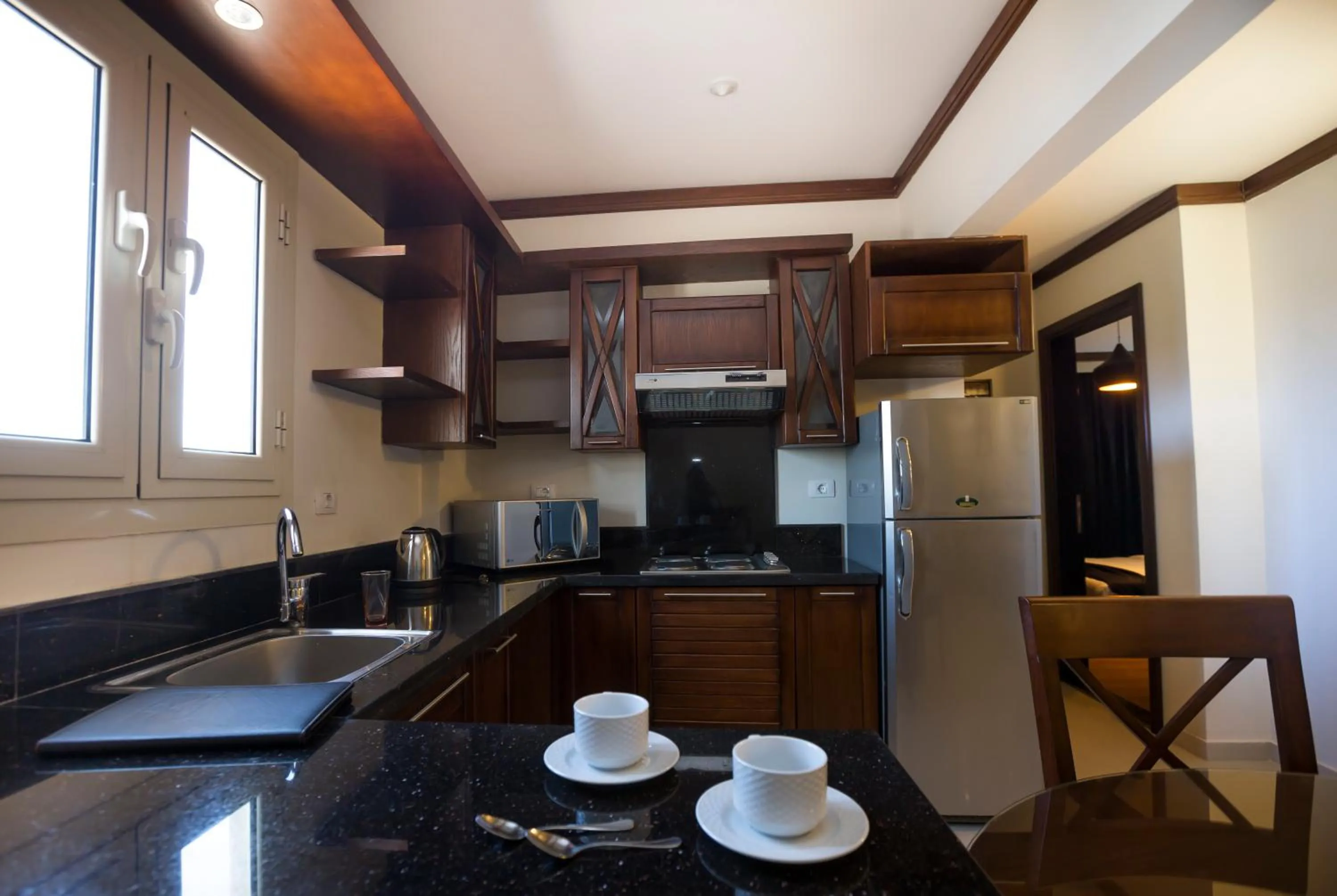 Kitchen or kitchenette in Panacea Suites Hotel