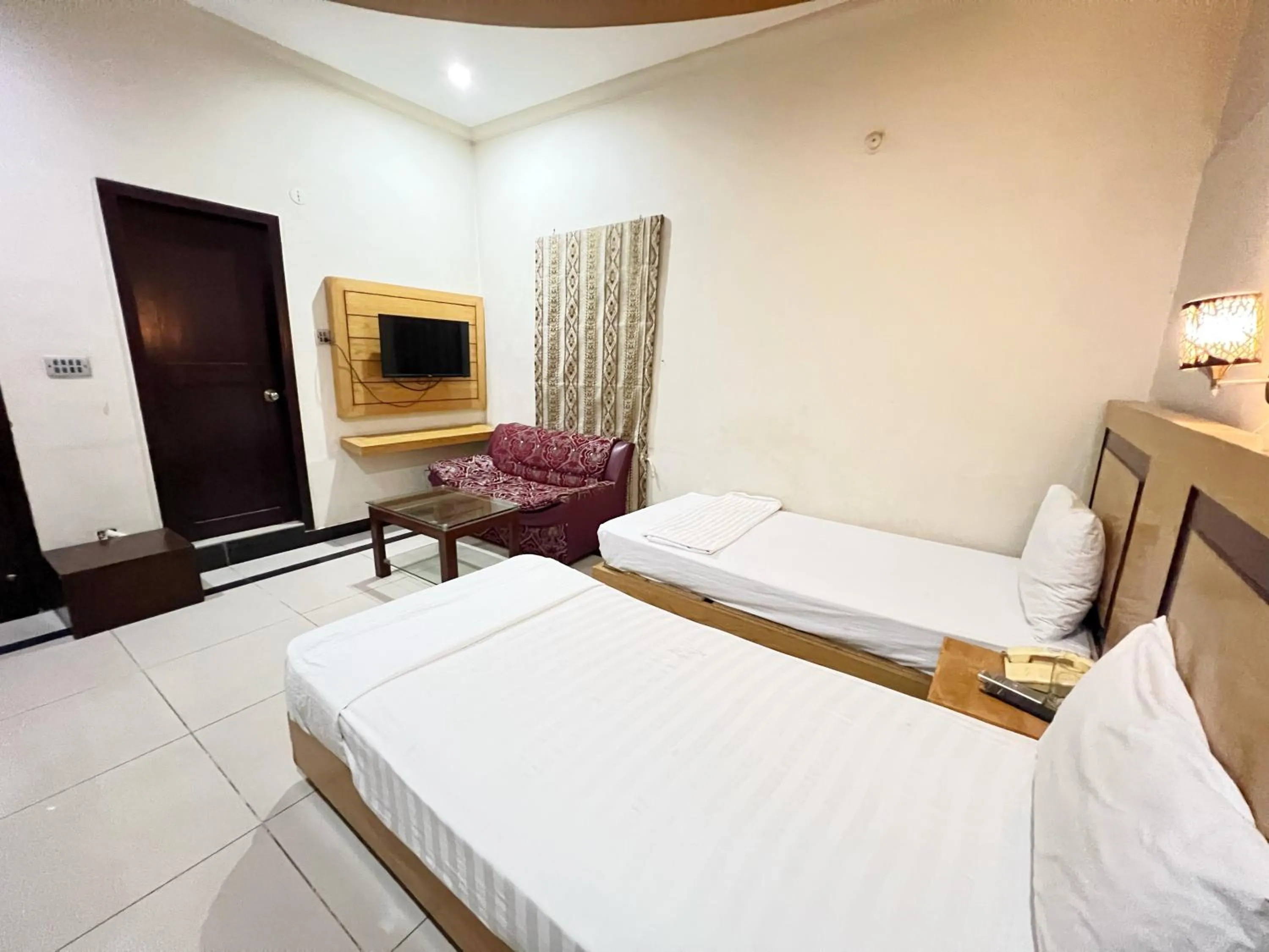 Bed in The Grand Hotel Multan