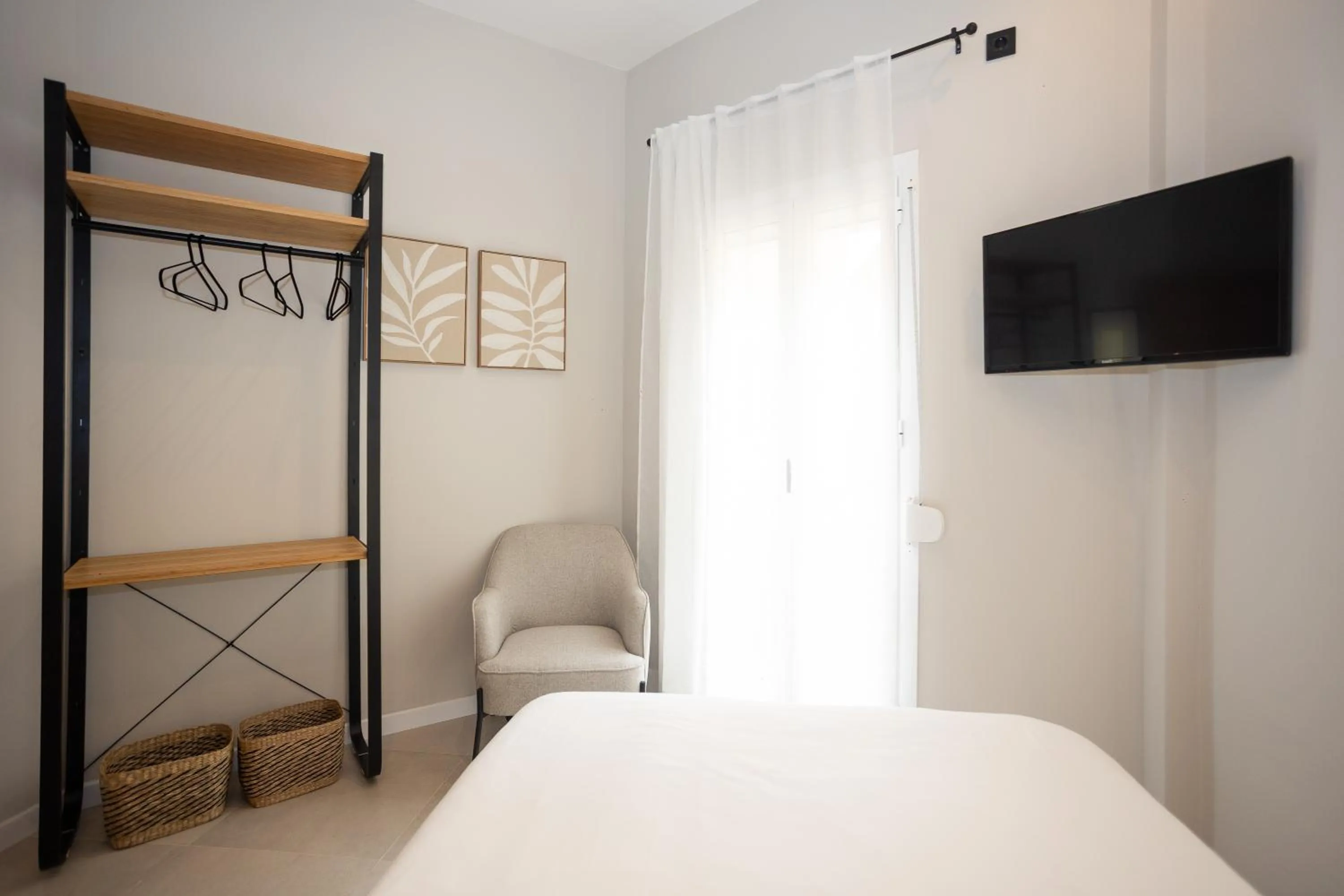 Bed in Chinitas Urban Rooms