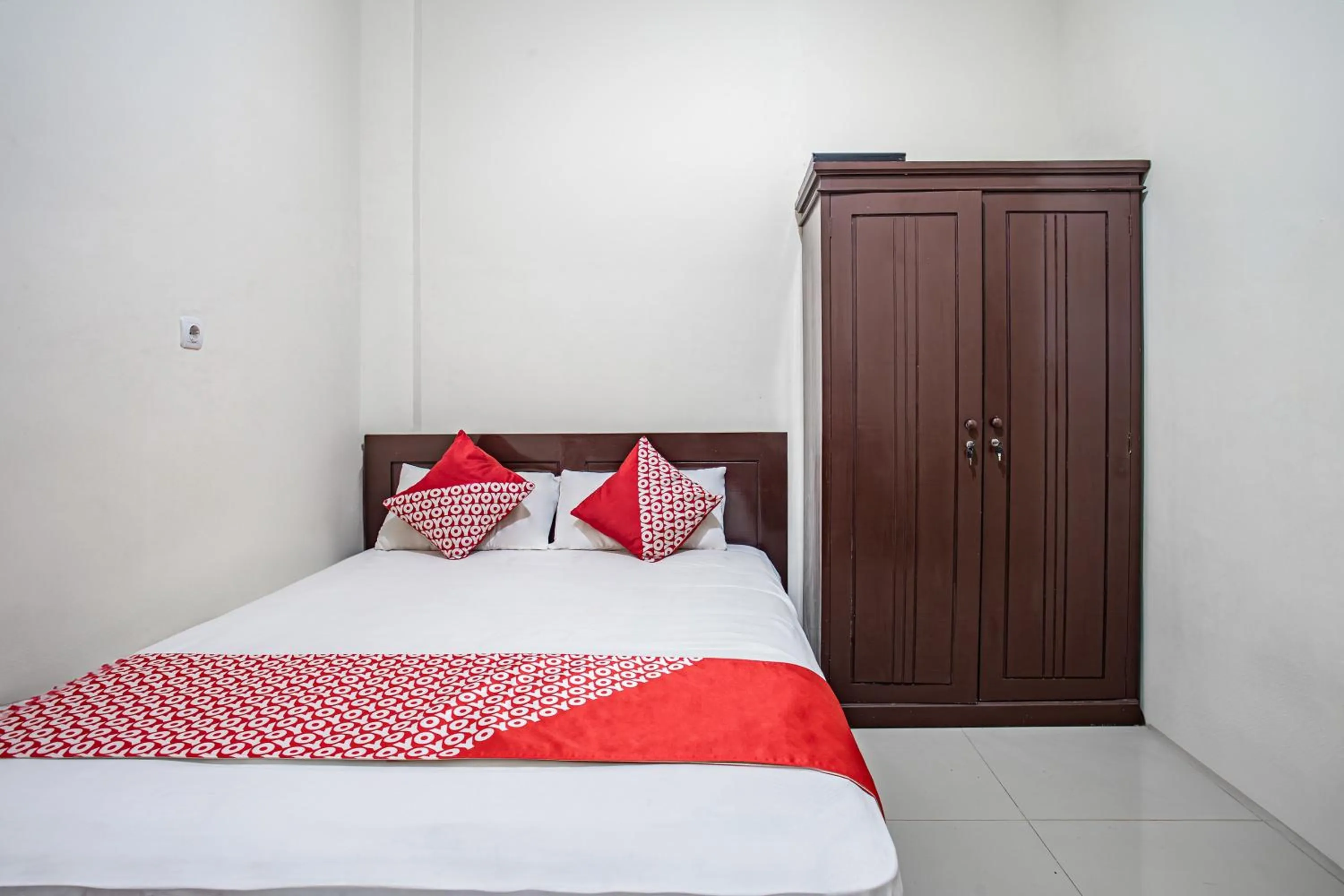 Bedroom in Hotel O Almahyra Guest House Syariah