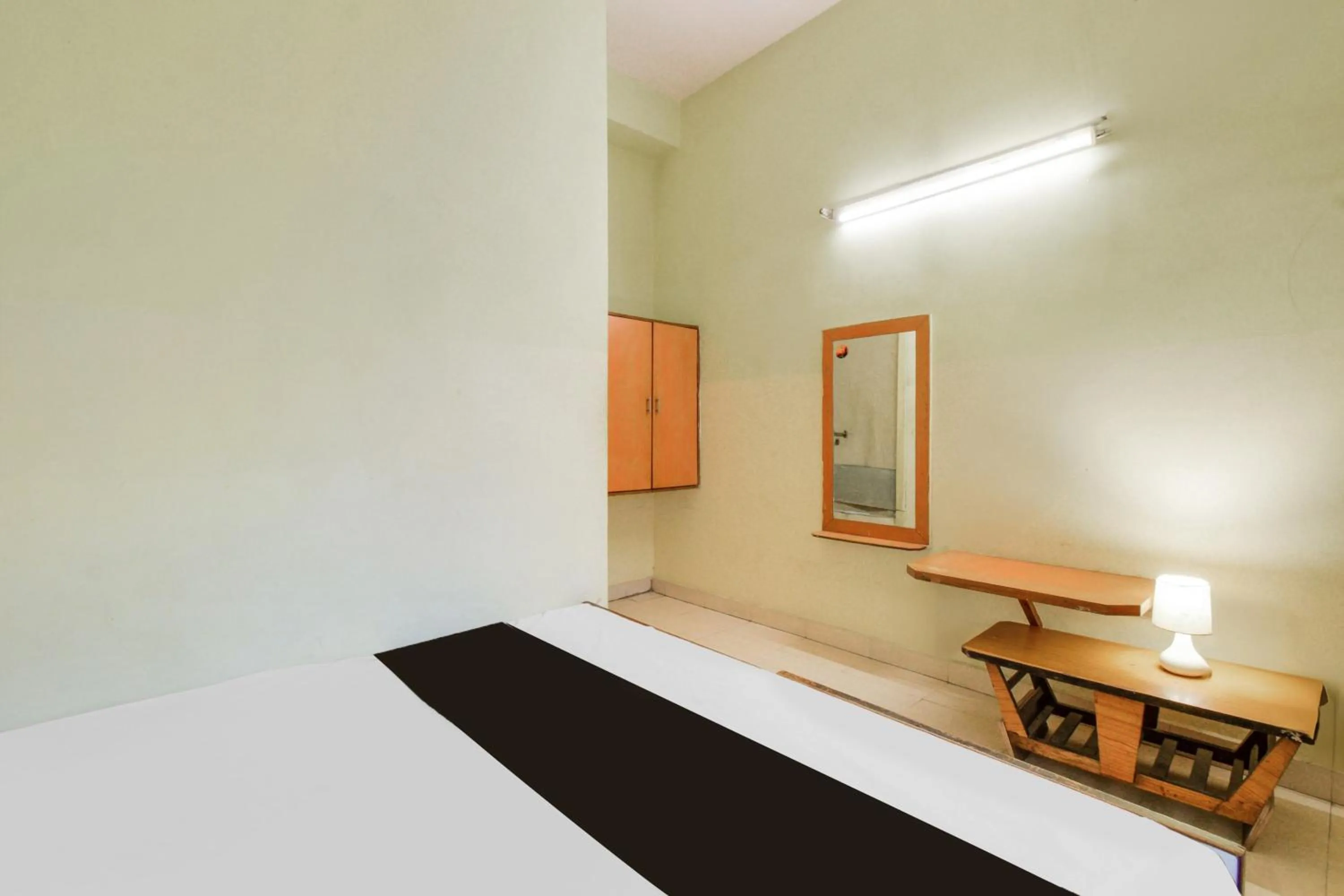 Bedroom in Hotel O New Sri Sai Amaravati Lodge