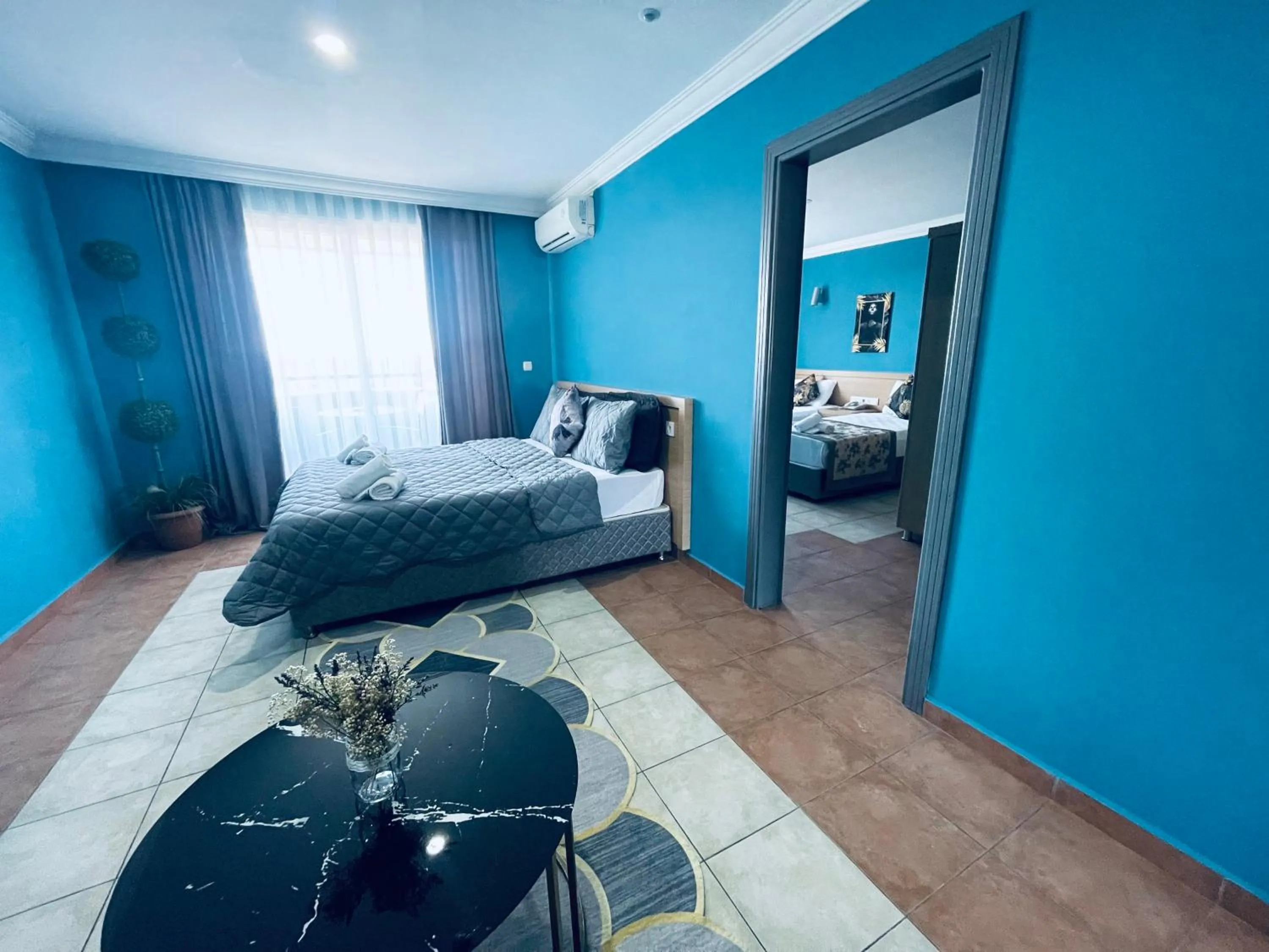 Communal lounge/ TV room, Bed in Grand Alisa Hotel (Ex. Royalisa Hotel)