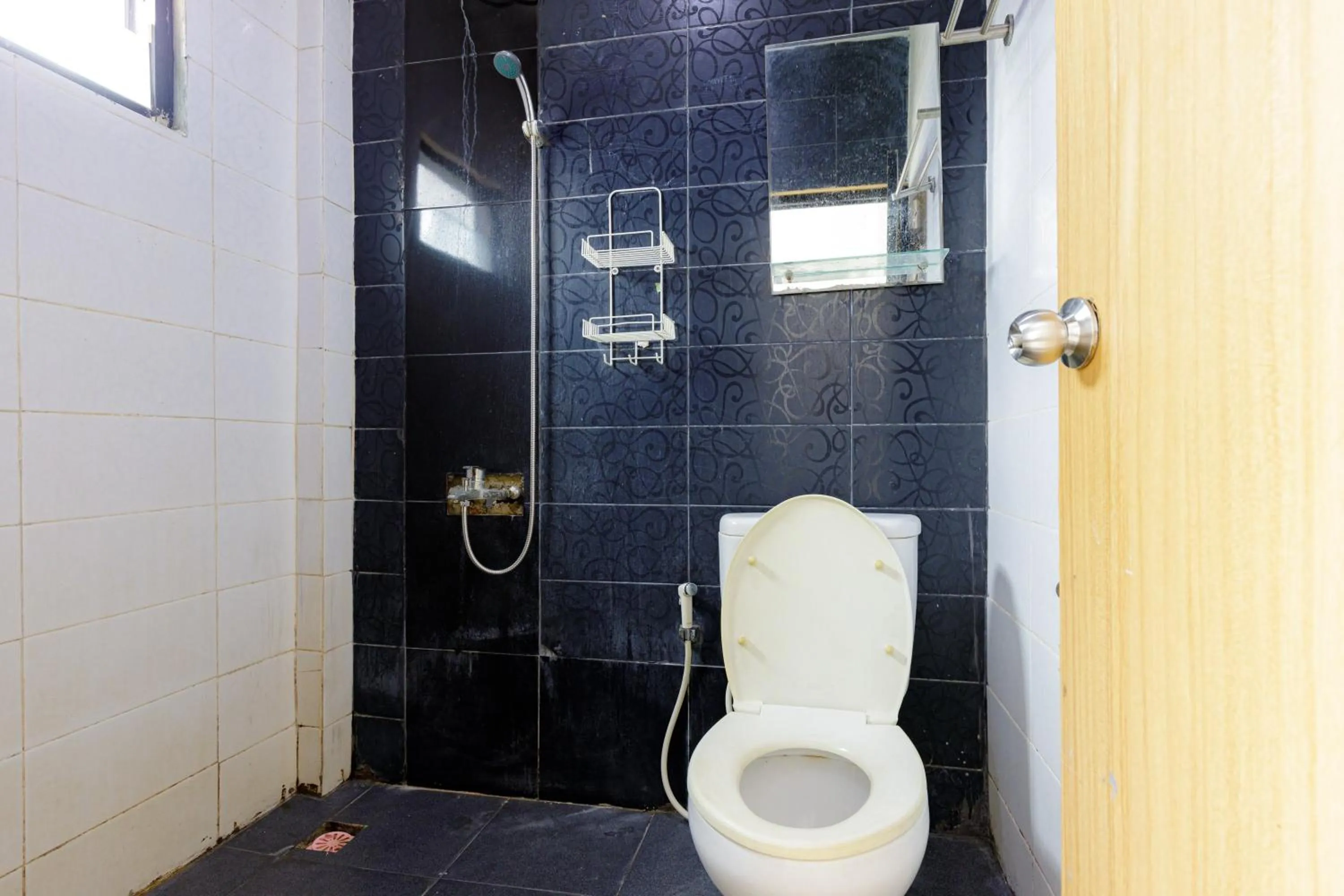 Bathroom in Urbanview SRB near Mall Ciputra Cibubur by RedDoorz