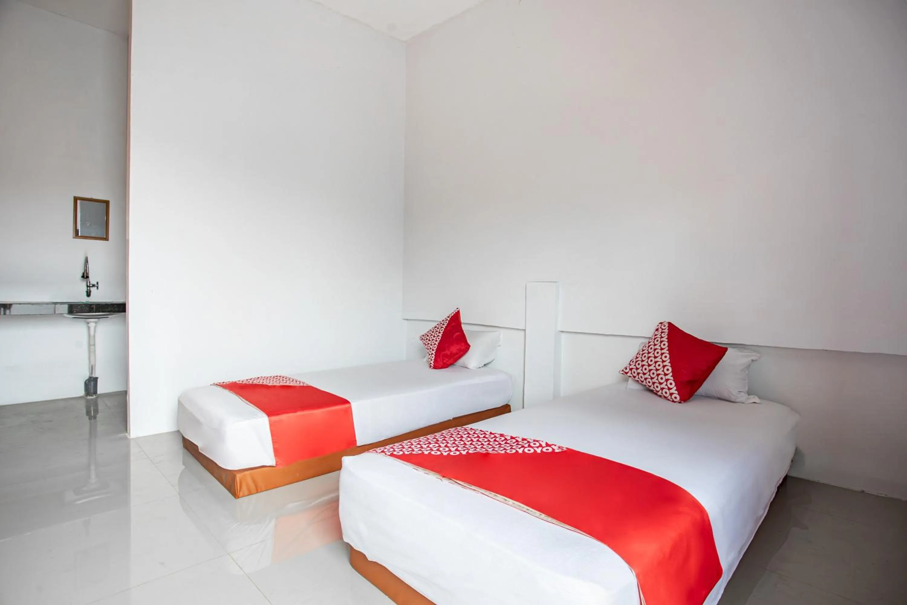 Bedroom in Hotel O Owo Guest House Syariah