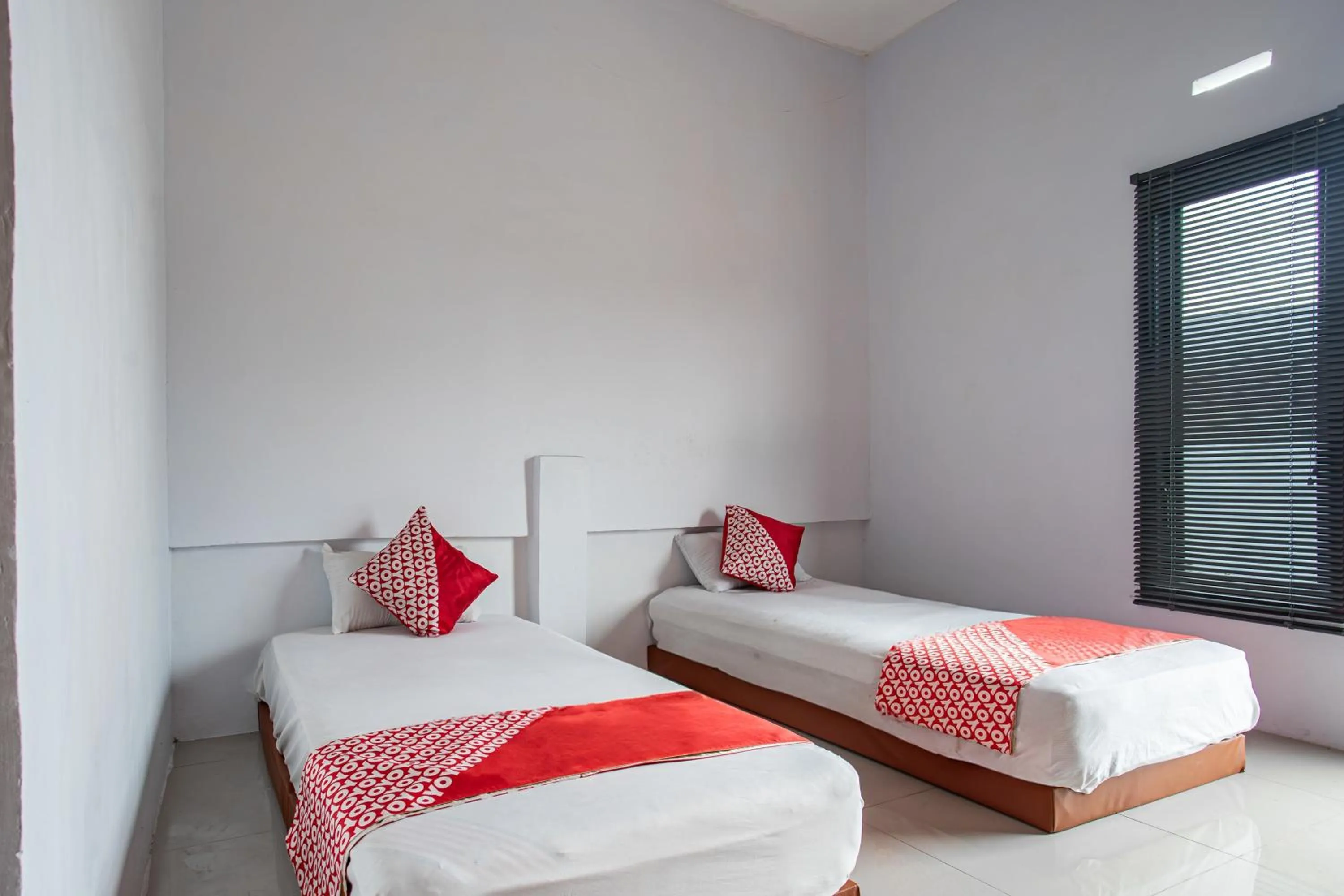 Bedroom in Hotel O Owo Guest House Syariah