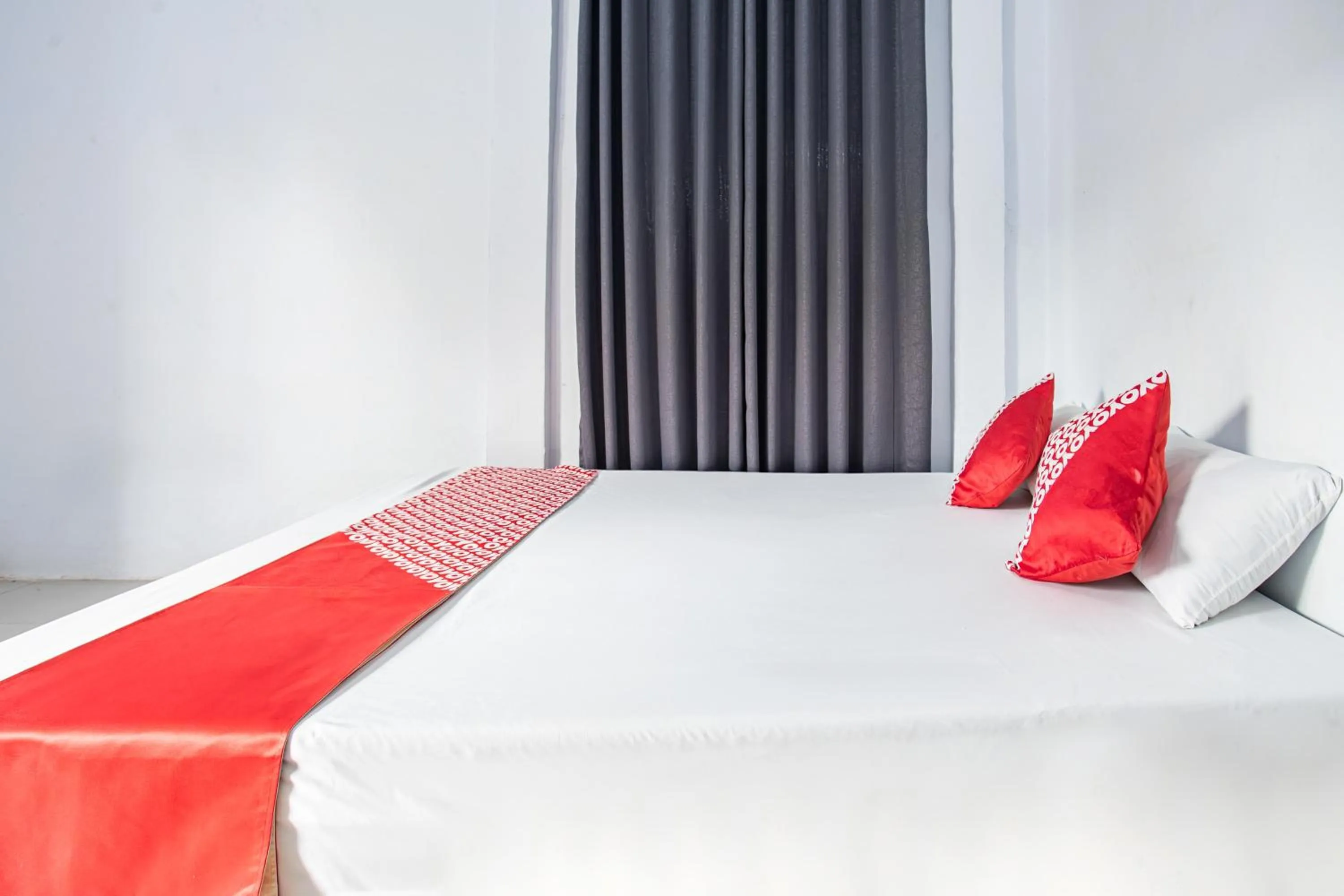 Bedroom in Hotel O Owo Guest House Syariah