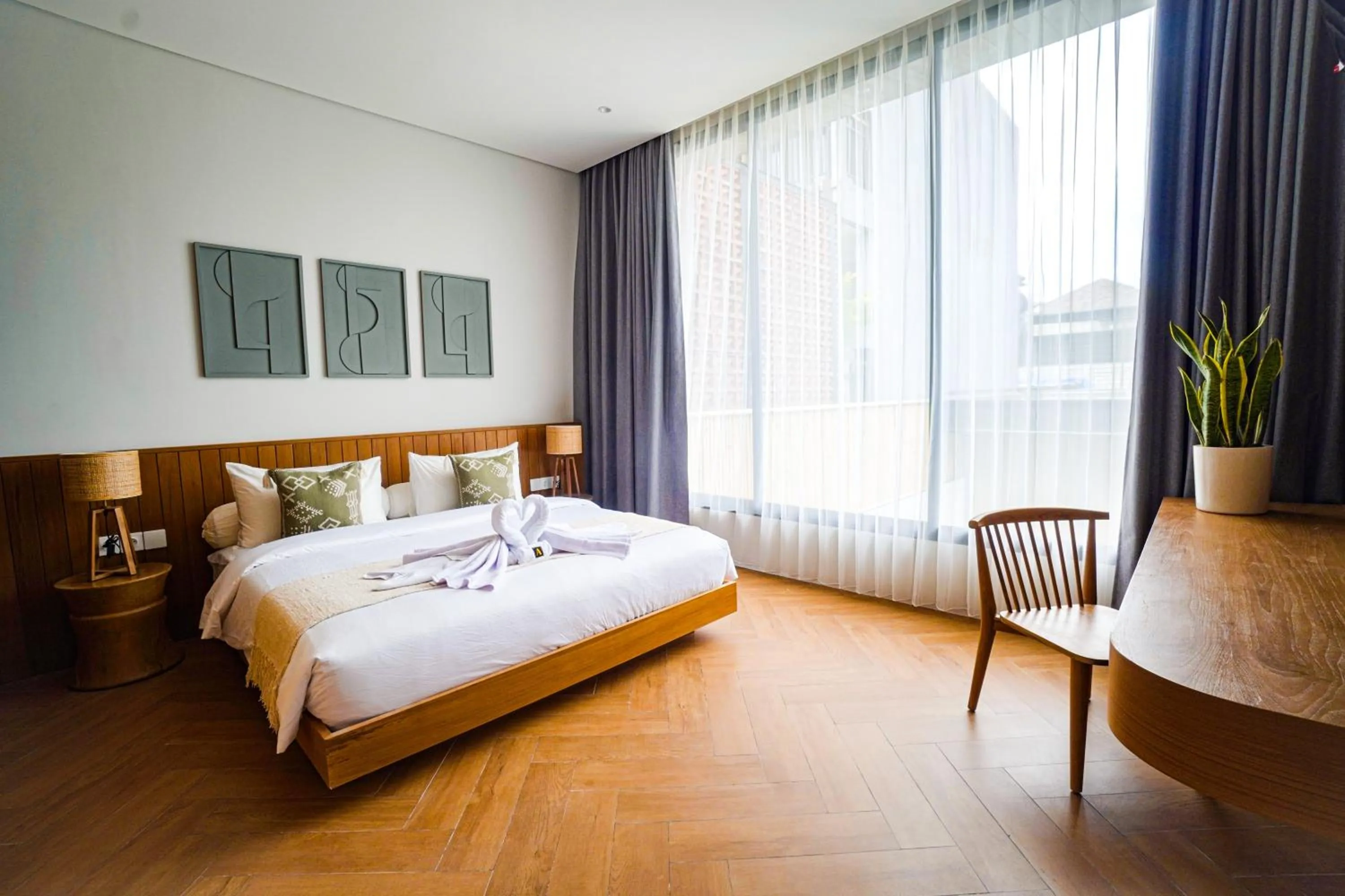 Bed in AMR Echo Beach Villa's Canggu