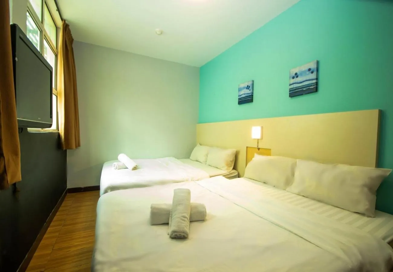 Bed in JQ Station Eight Inn